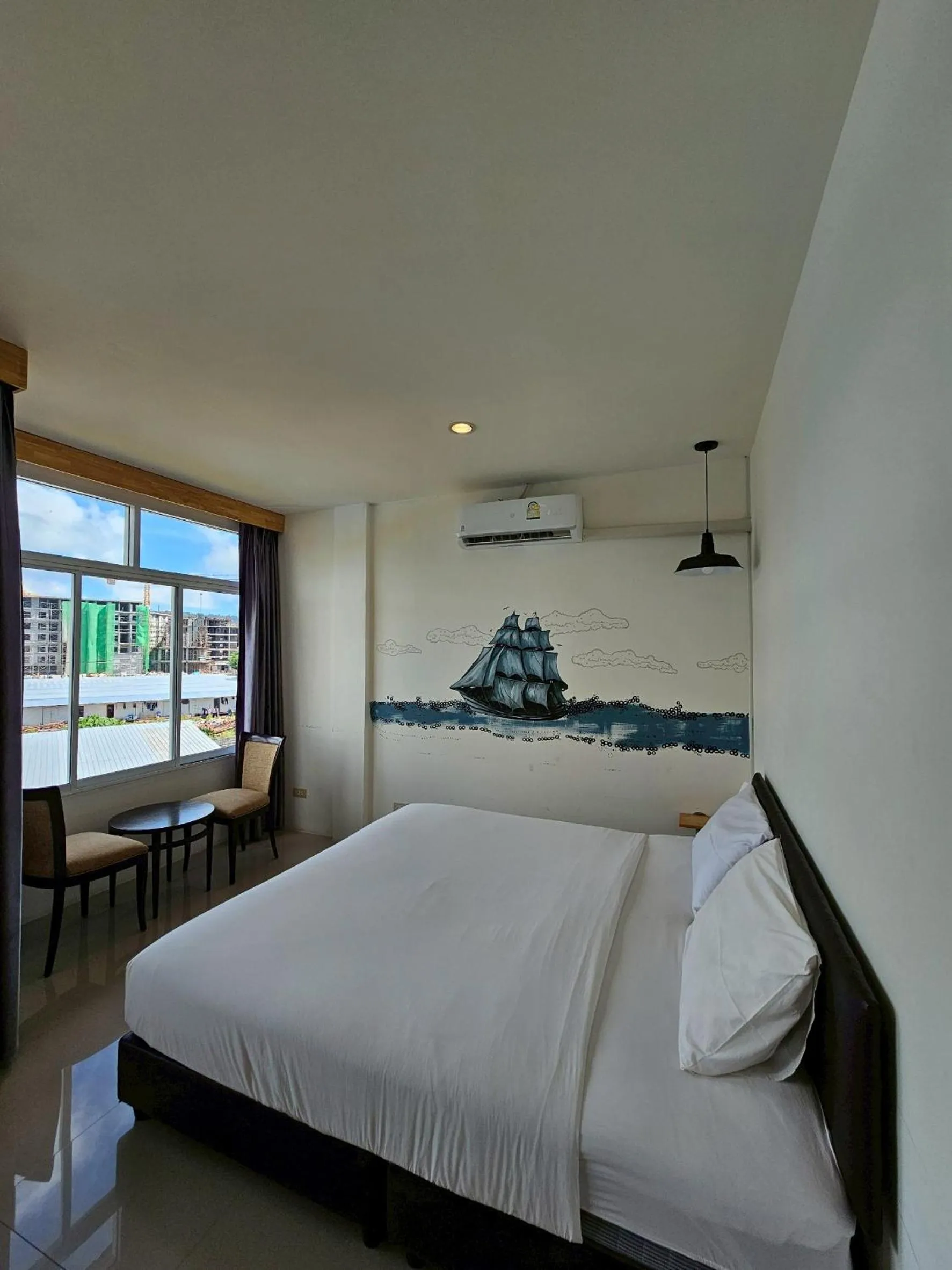 Bed in Dwell Phuket Airport Hotel at Naiyang