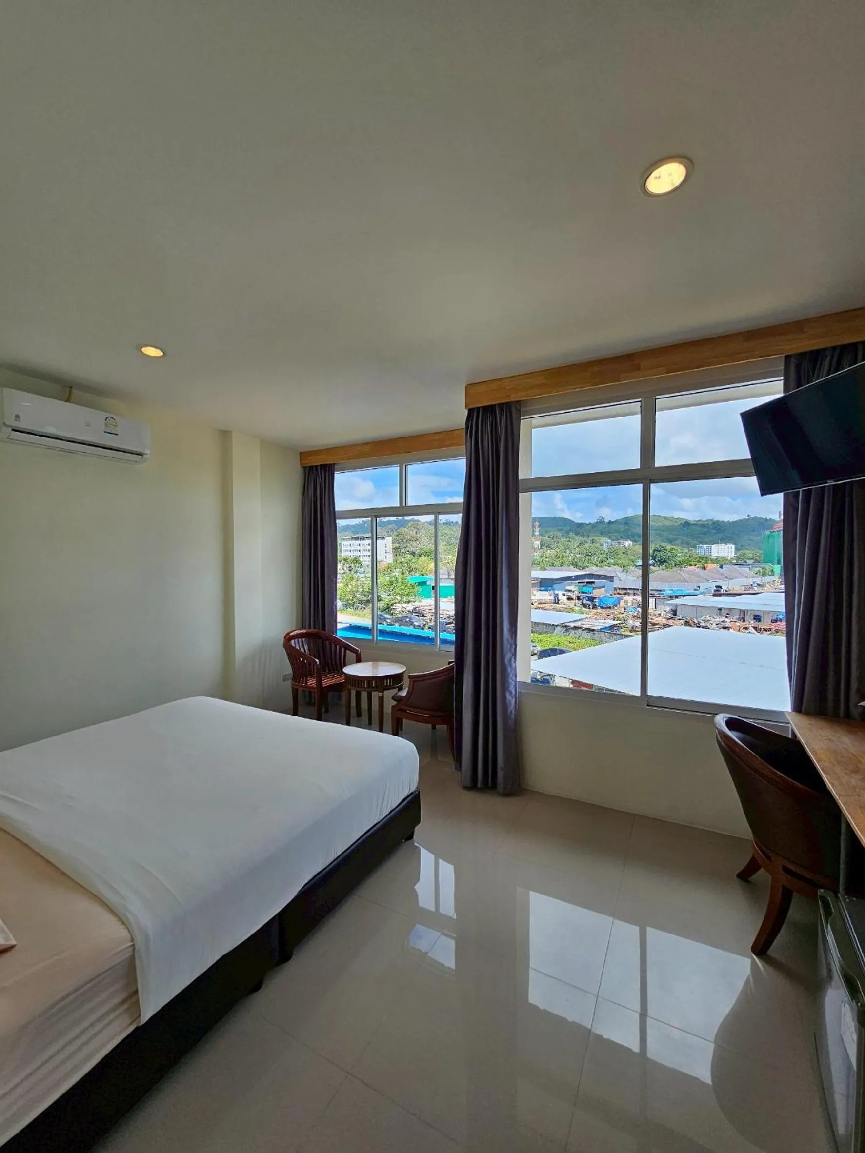 Bed in Dwell Phuket Airport Hotel at Naiyang