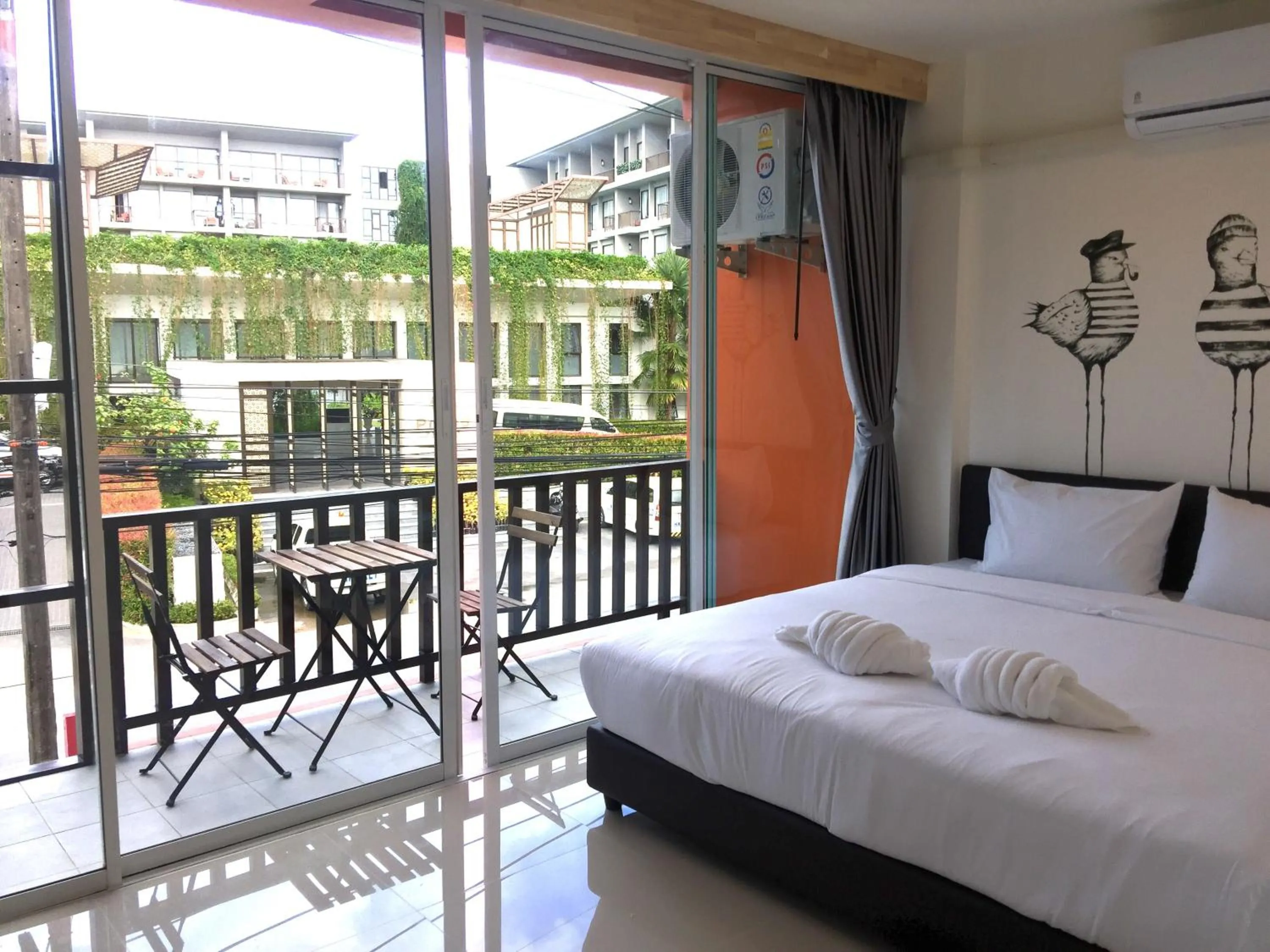 Balcony/Terrace, Bed in Dwell Phuket Airport Hotel at Naiyang