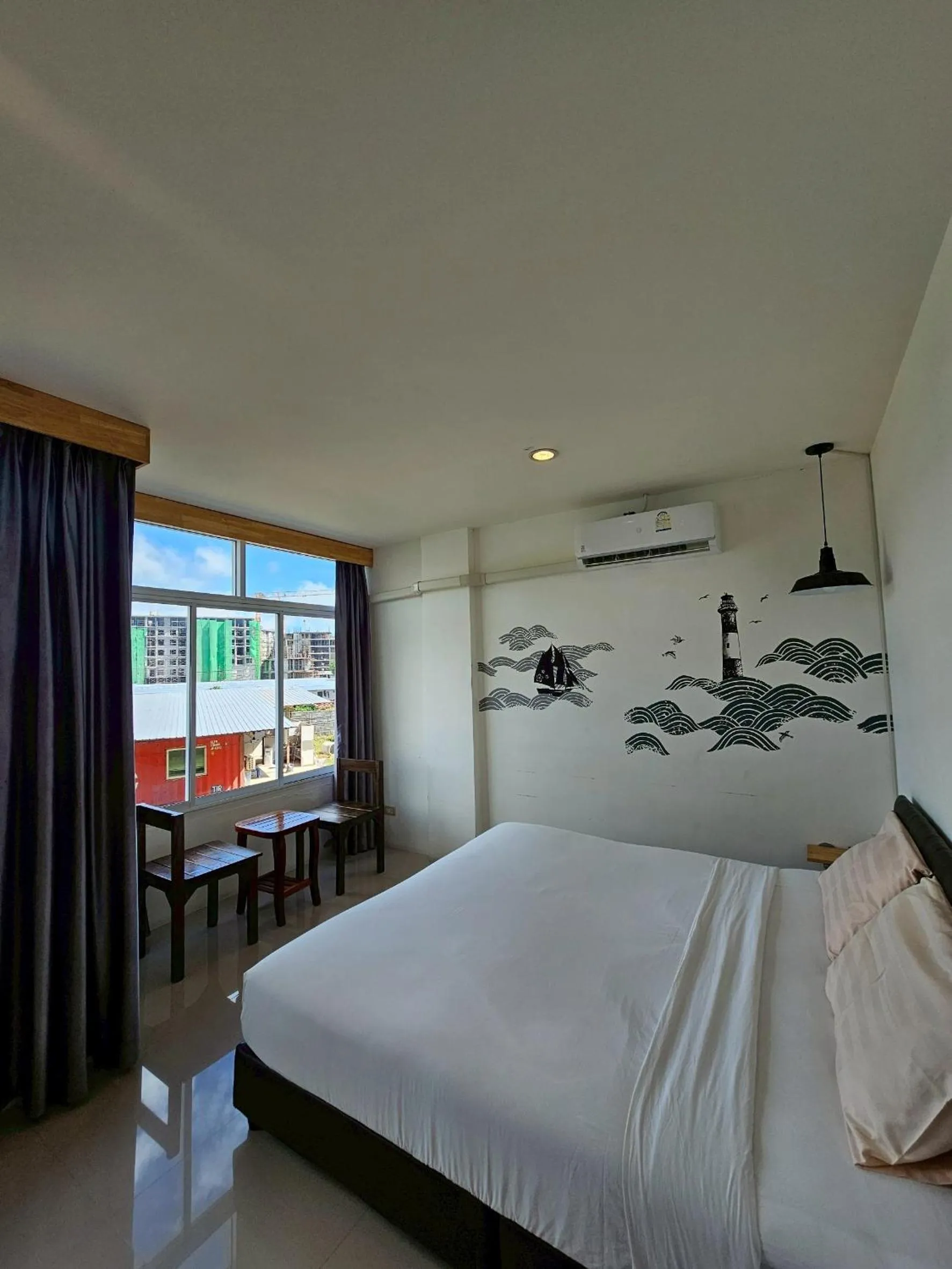 Bed in Dwell Phuket Airport Hotel at Naiyang