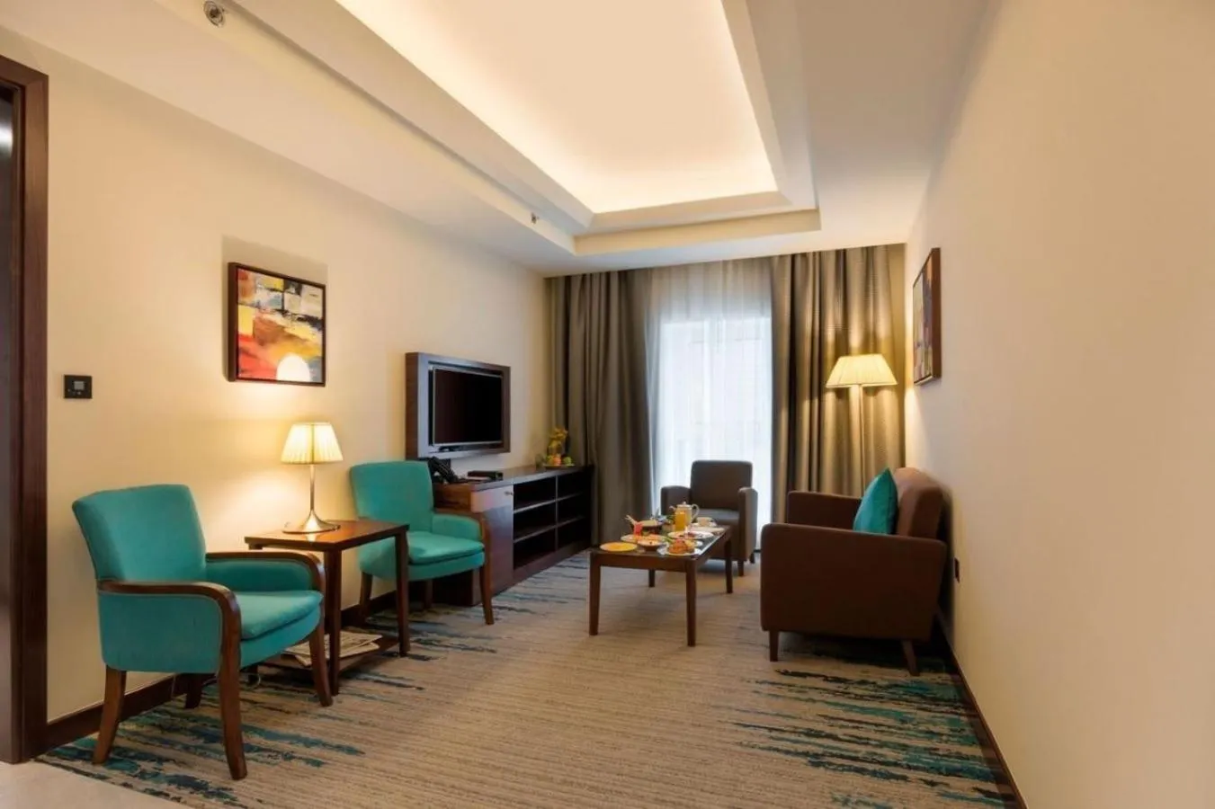 Living room in Golden Tulip Media Hotel