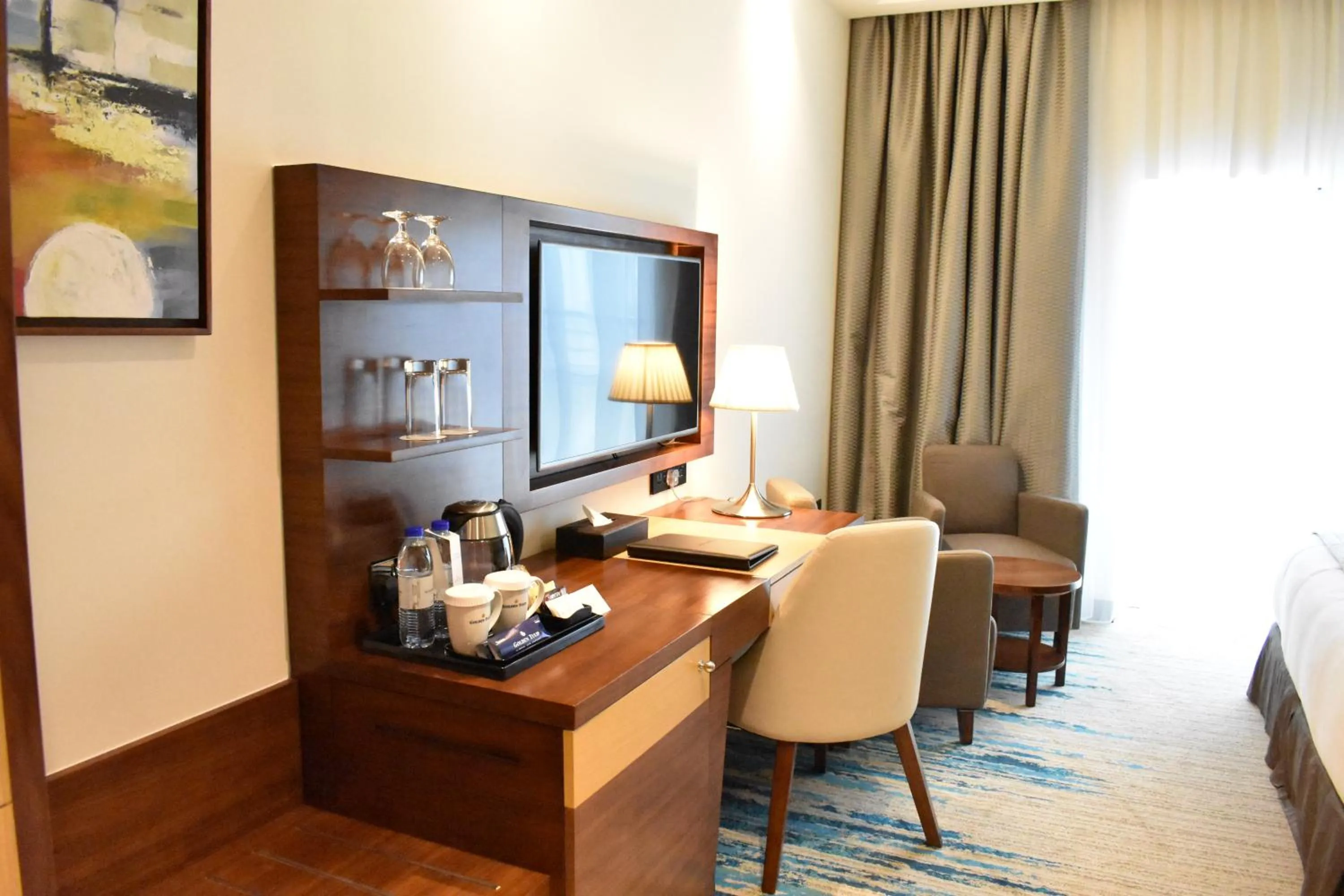 Seating area in Golden Tulip Media Hotel