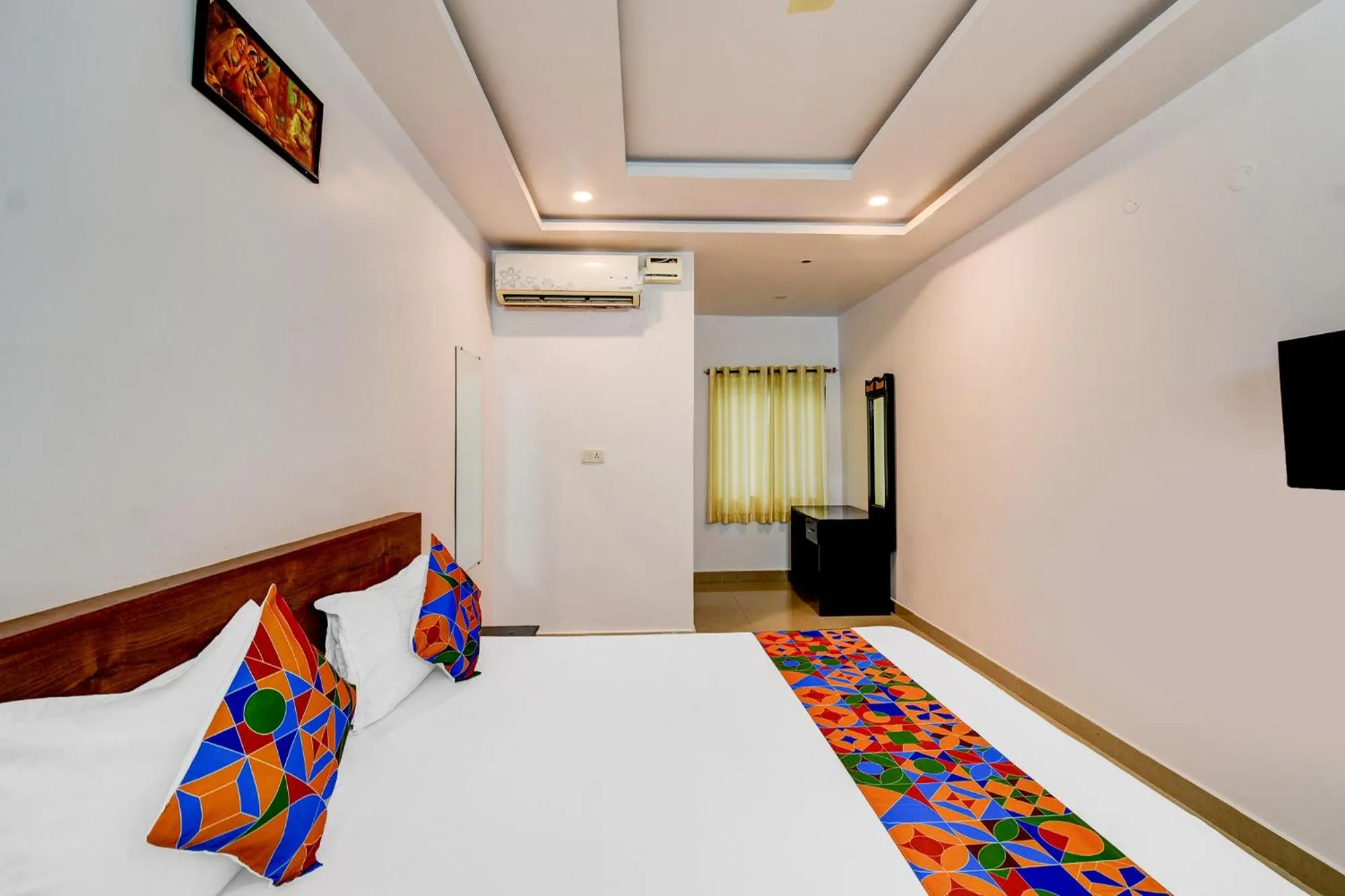 Bed in FabHotel Pushpa Grand