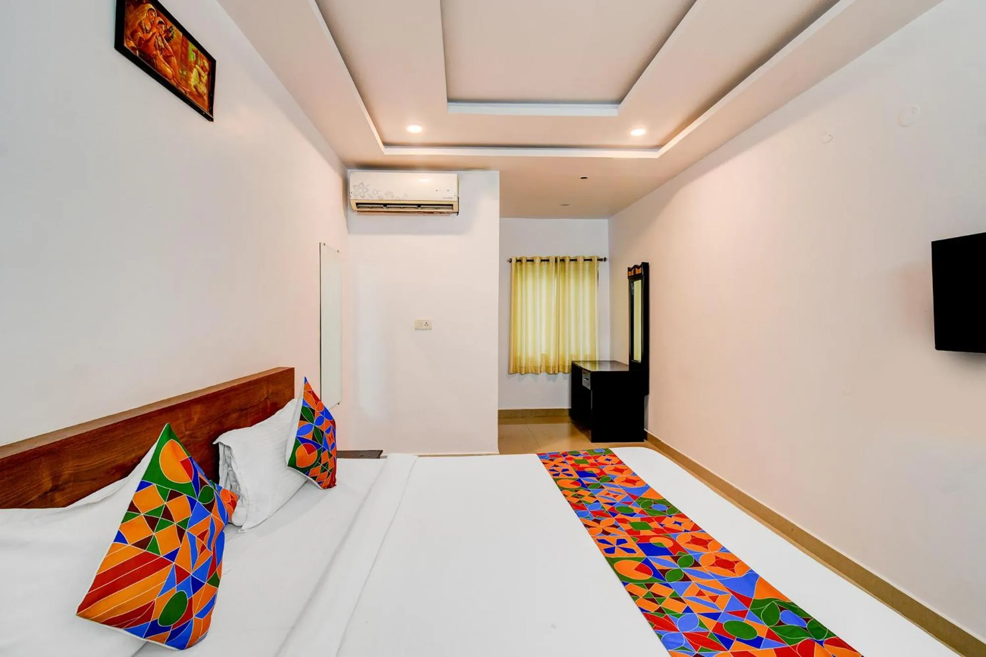 Bed in FabHotel Pushpa Grand