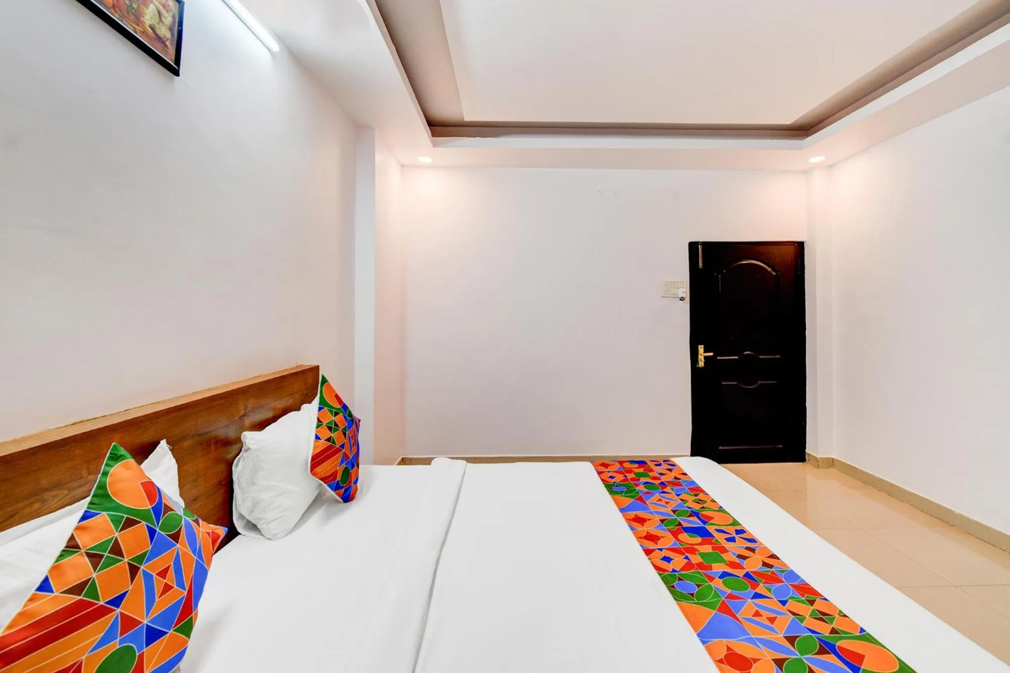 Bed in FabHotel Pushpa Grand