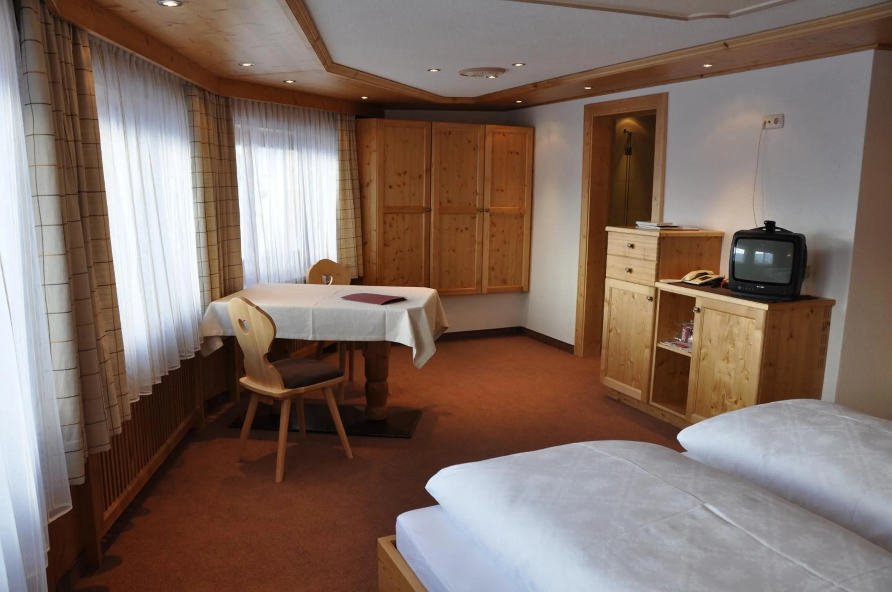 Seating area, Bed in Gasthof Valluga