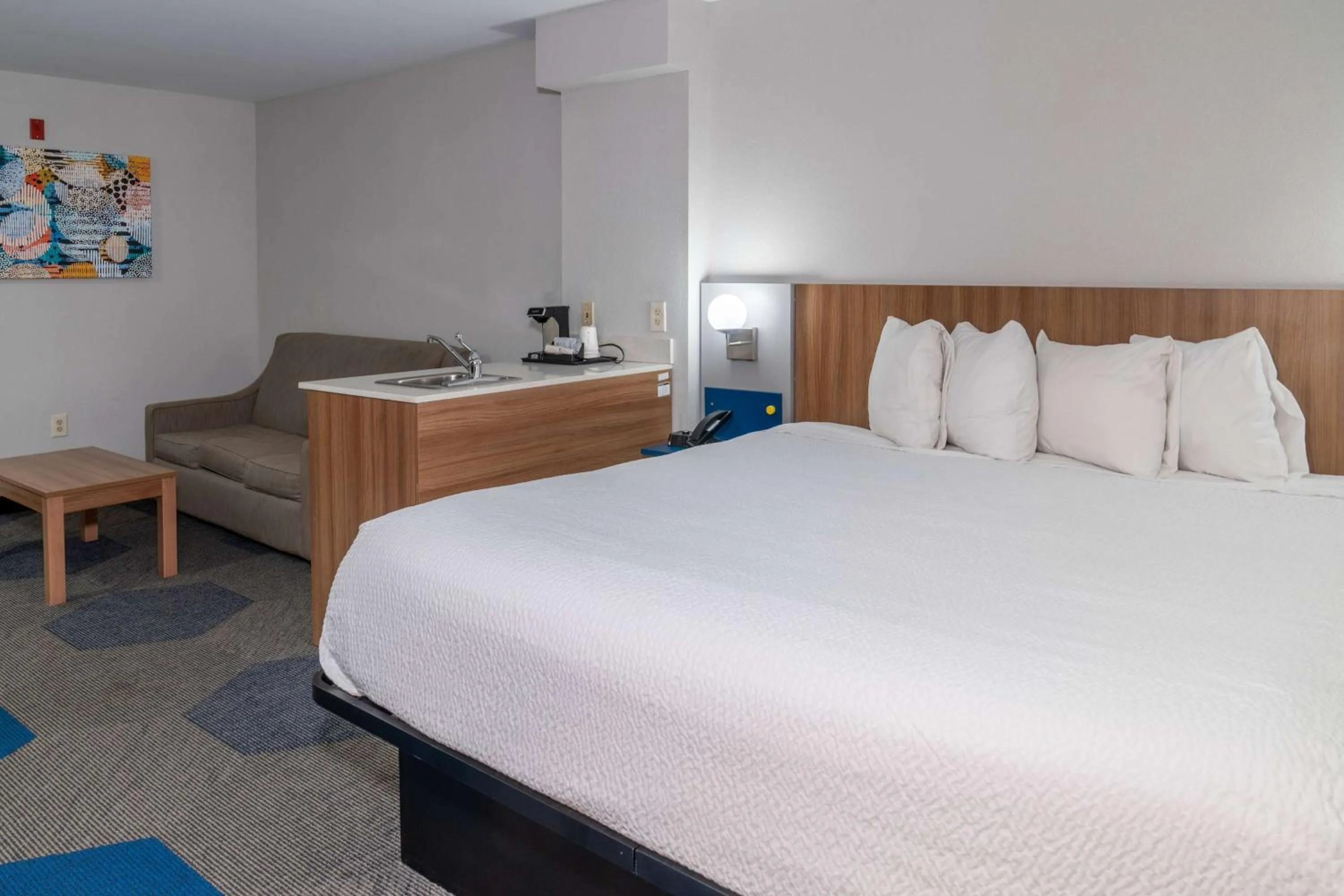 Bed in Microtel Inn & Suites by Wyndham Pigeon Forge