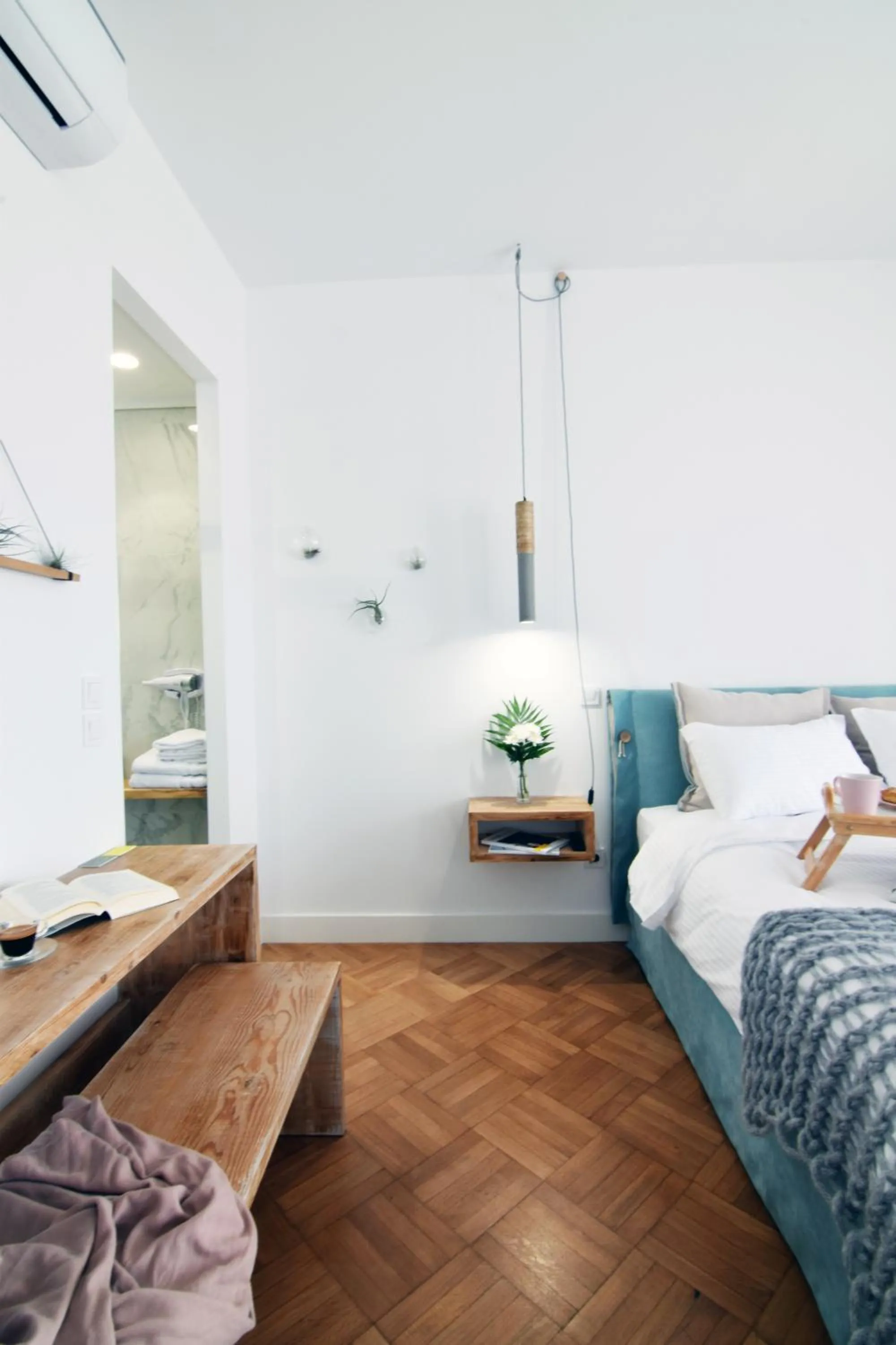 Bed in Grey Studios by Skg Apartments