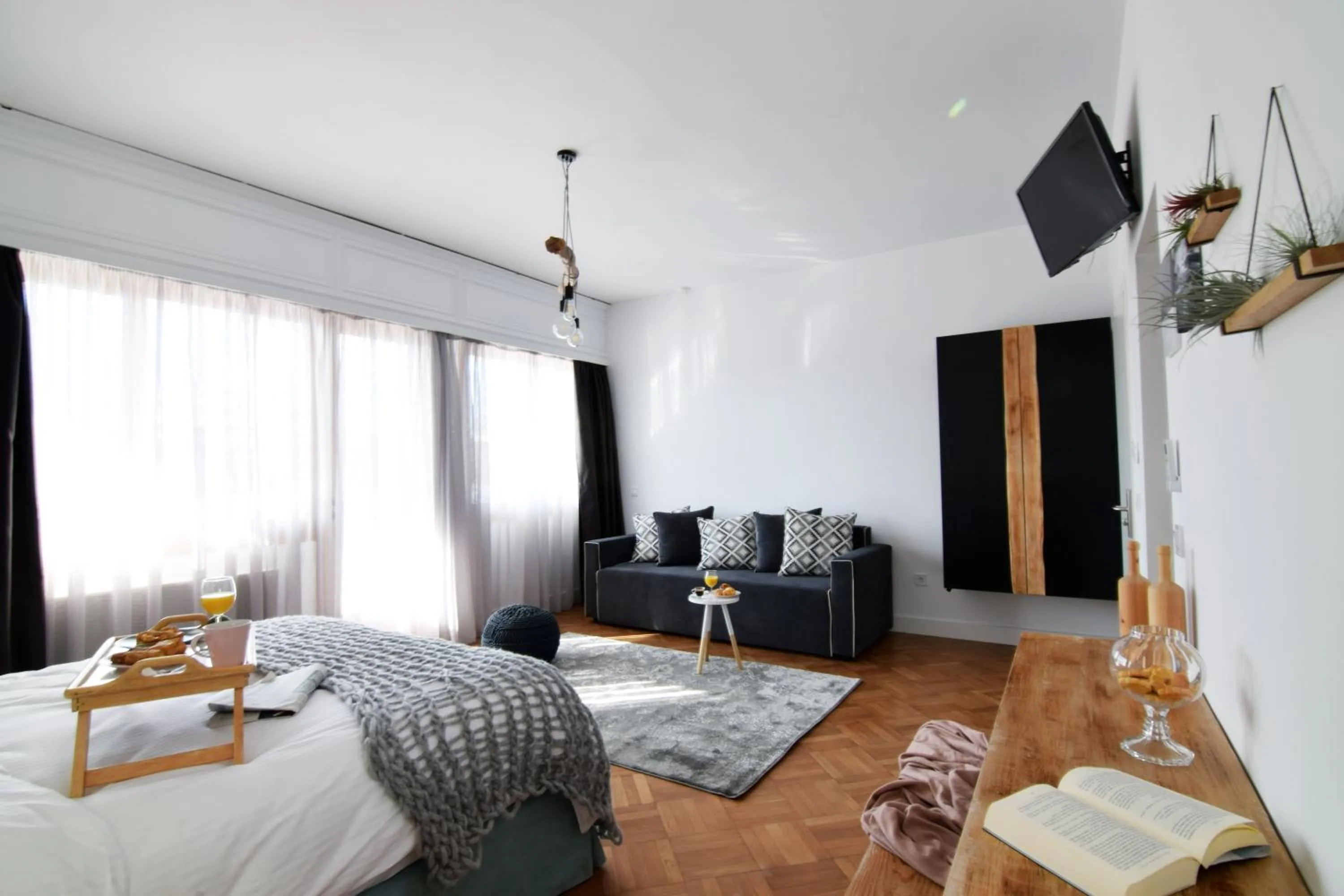 Bed in Grey Studios by Skg Apartments