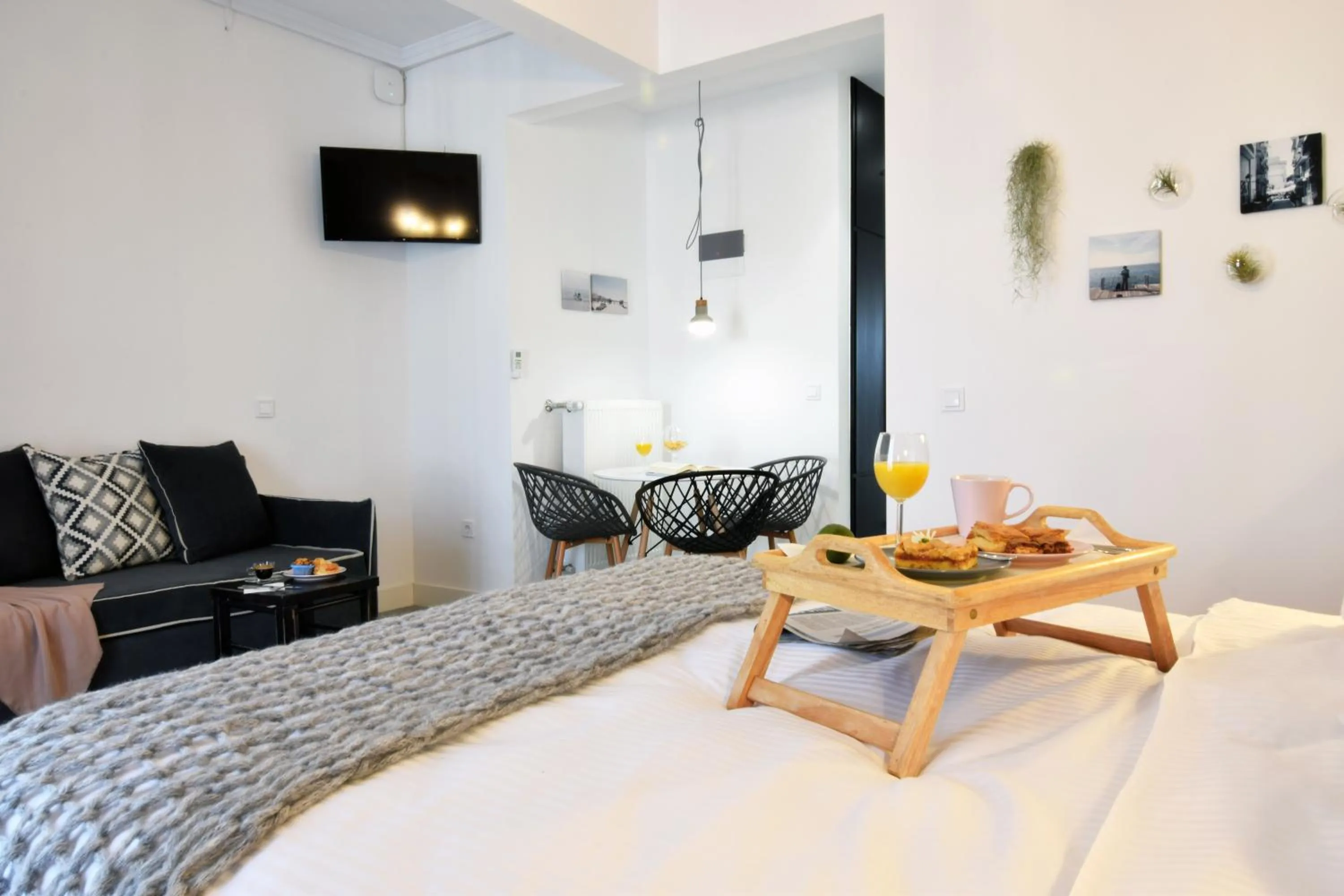 Bed in Grey Studios by Skg Apartments