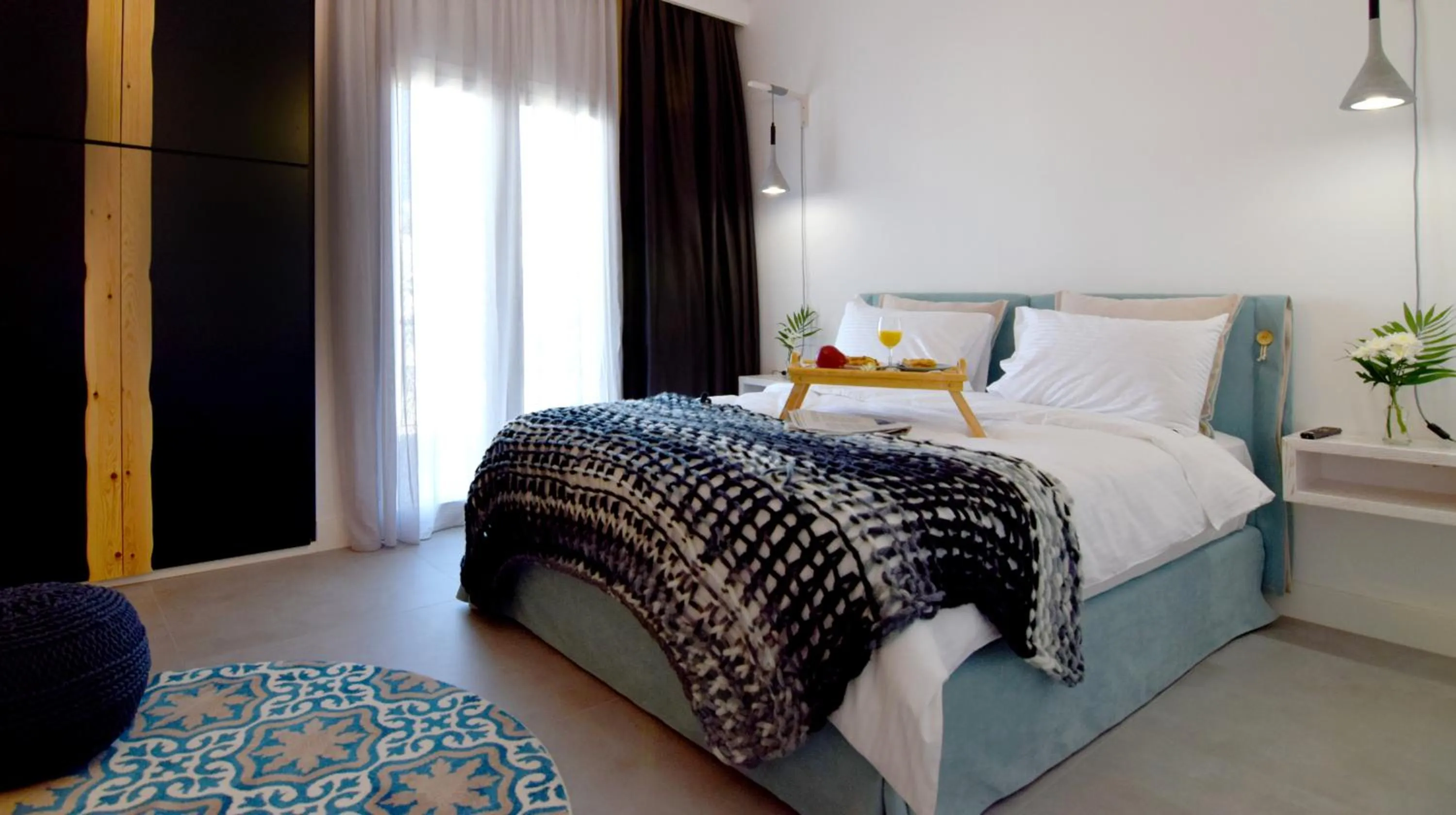 Bed in Grey Studios by Skg Apartments