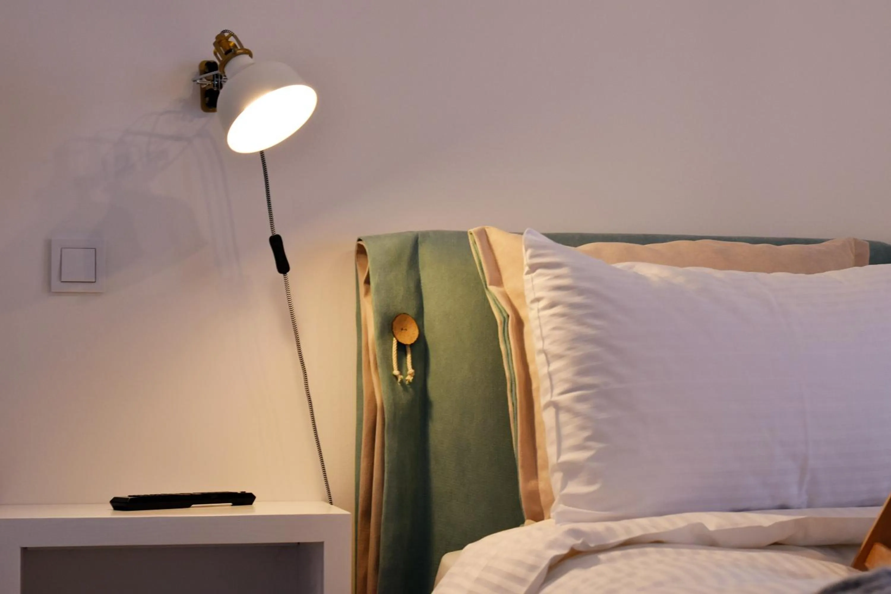 Bed in Grey Studios by Skg Apartments