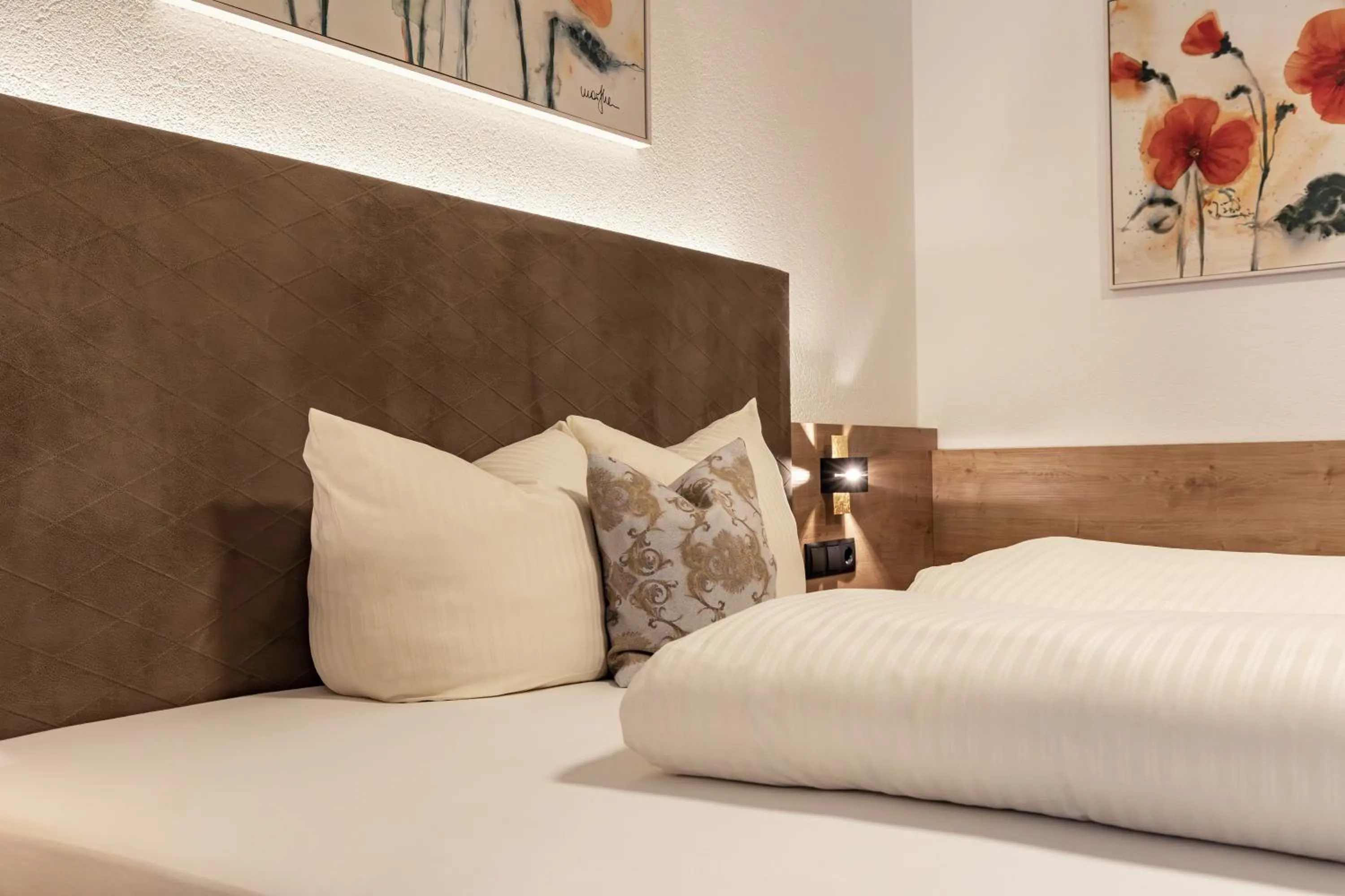 Bed in Das Aparthotel Olympia Tirol