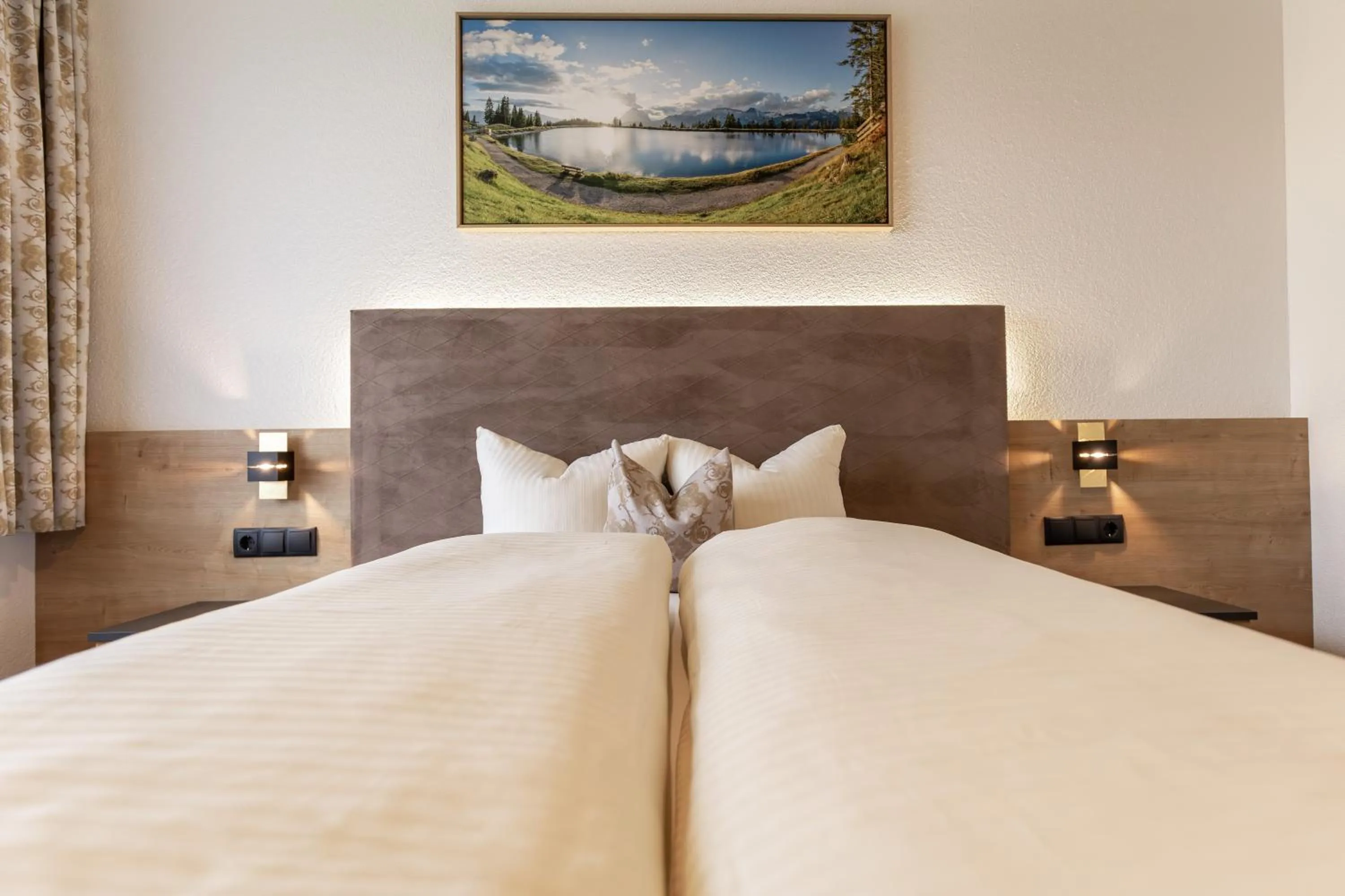 Bed in Das Aparthotel Olympia Tirol