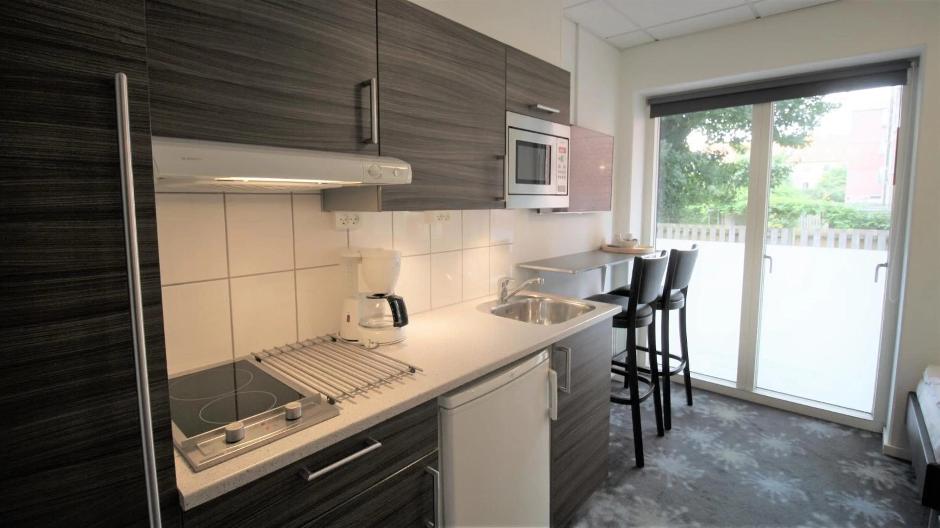 Kitchen or kitchenette in ApartHotel Faber