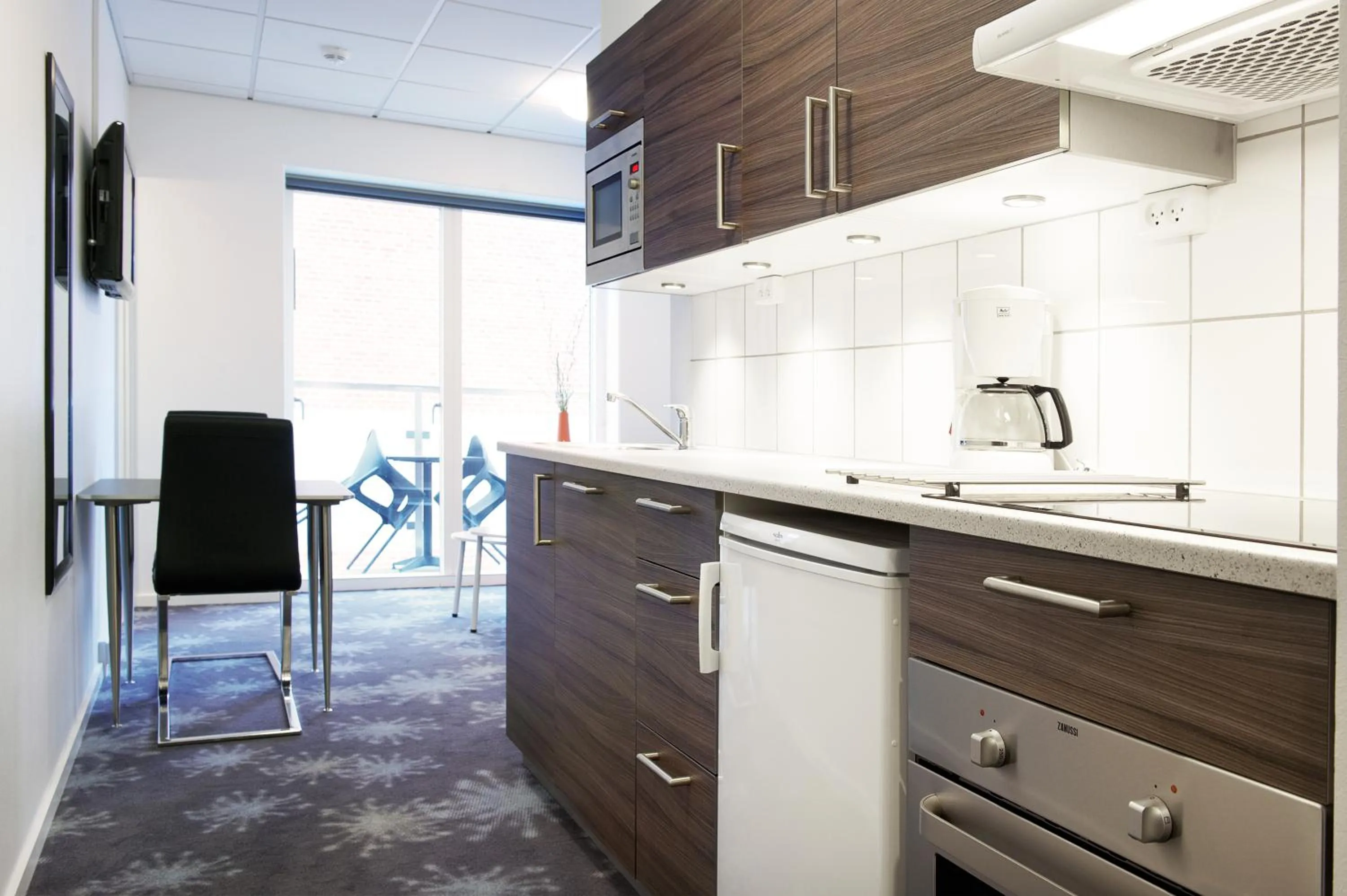 Kitchen or kitchenette in ApartHotel Faber