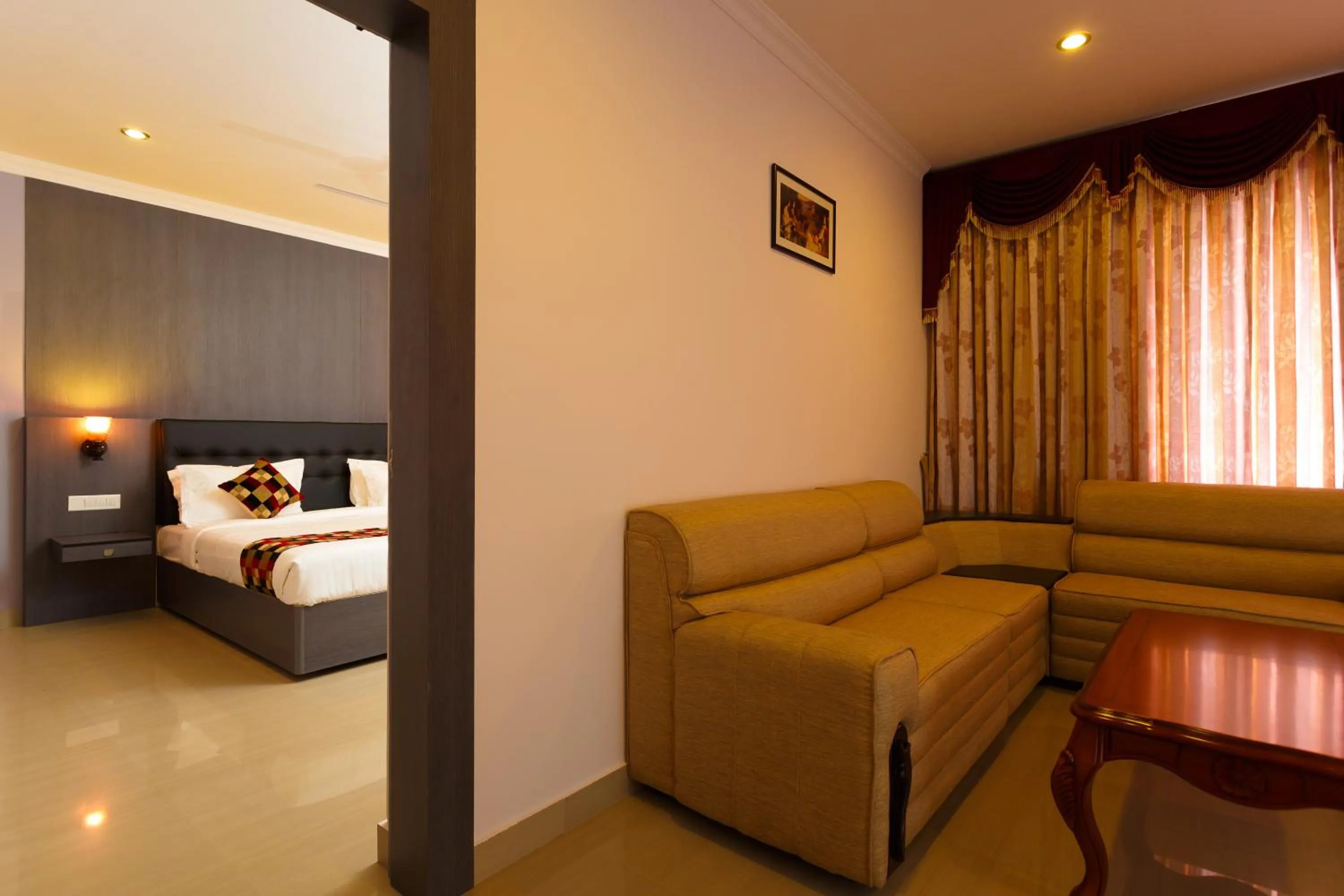 Living room, Bed in Hotel Gopalapuram International