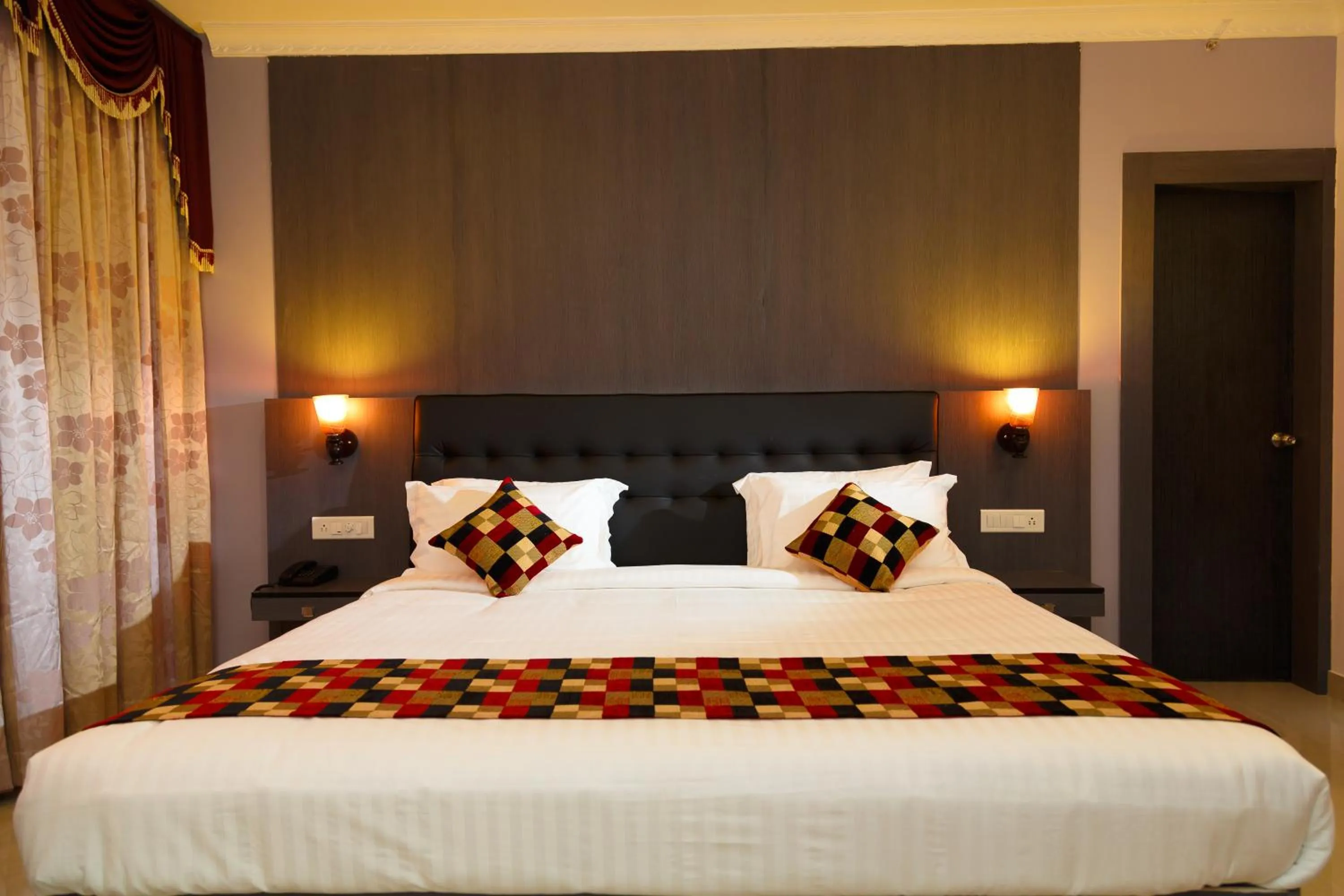 Bed in Hotel Gopalapuram International
