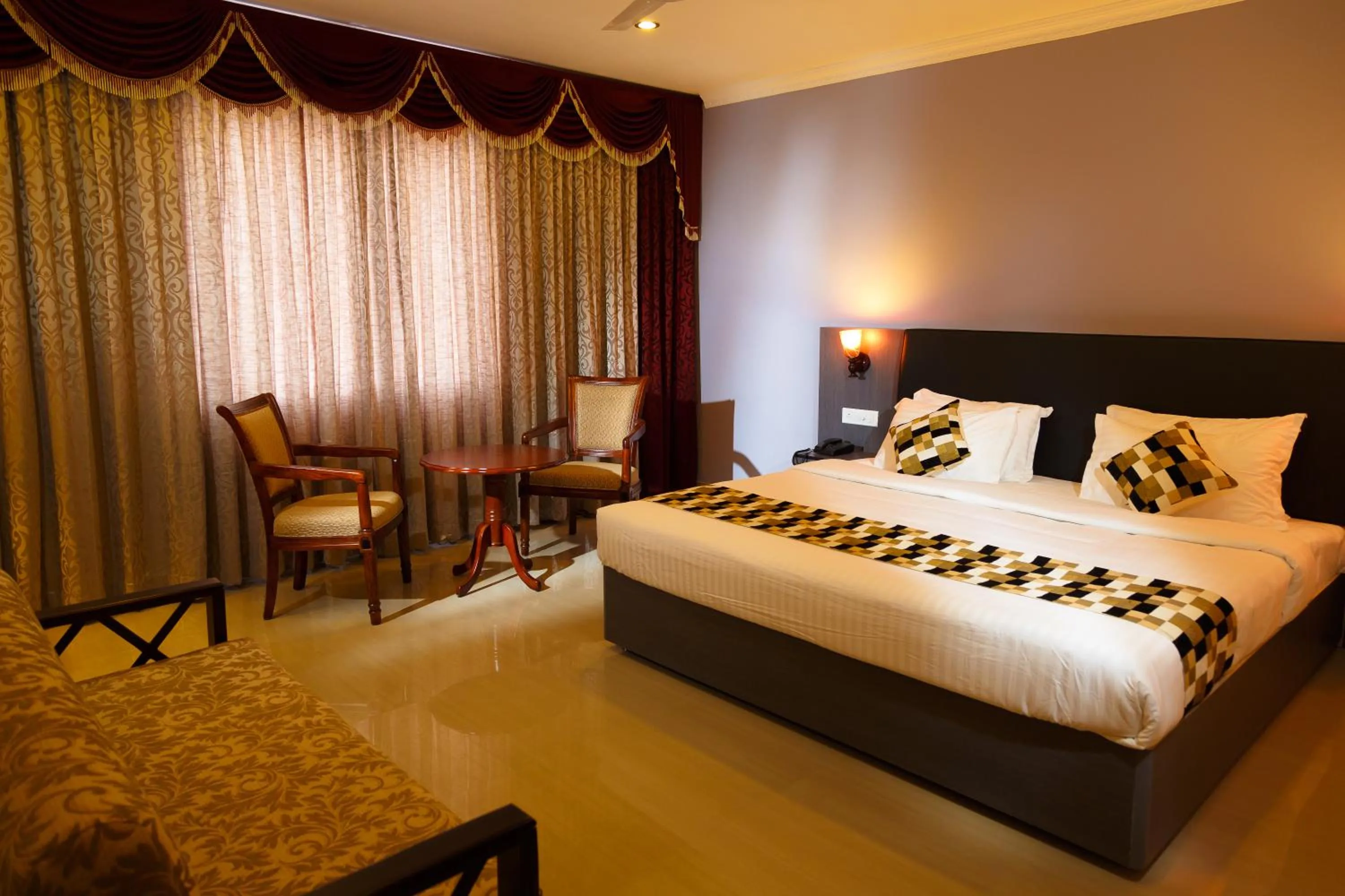 Bed in Hotel Gopalapuram International