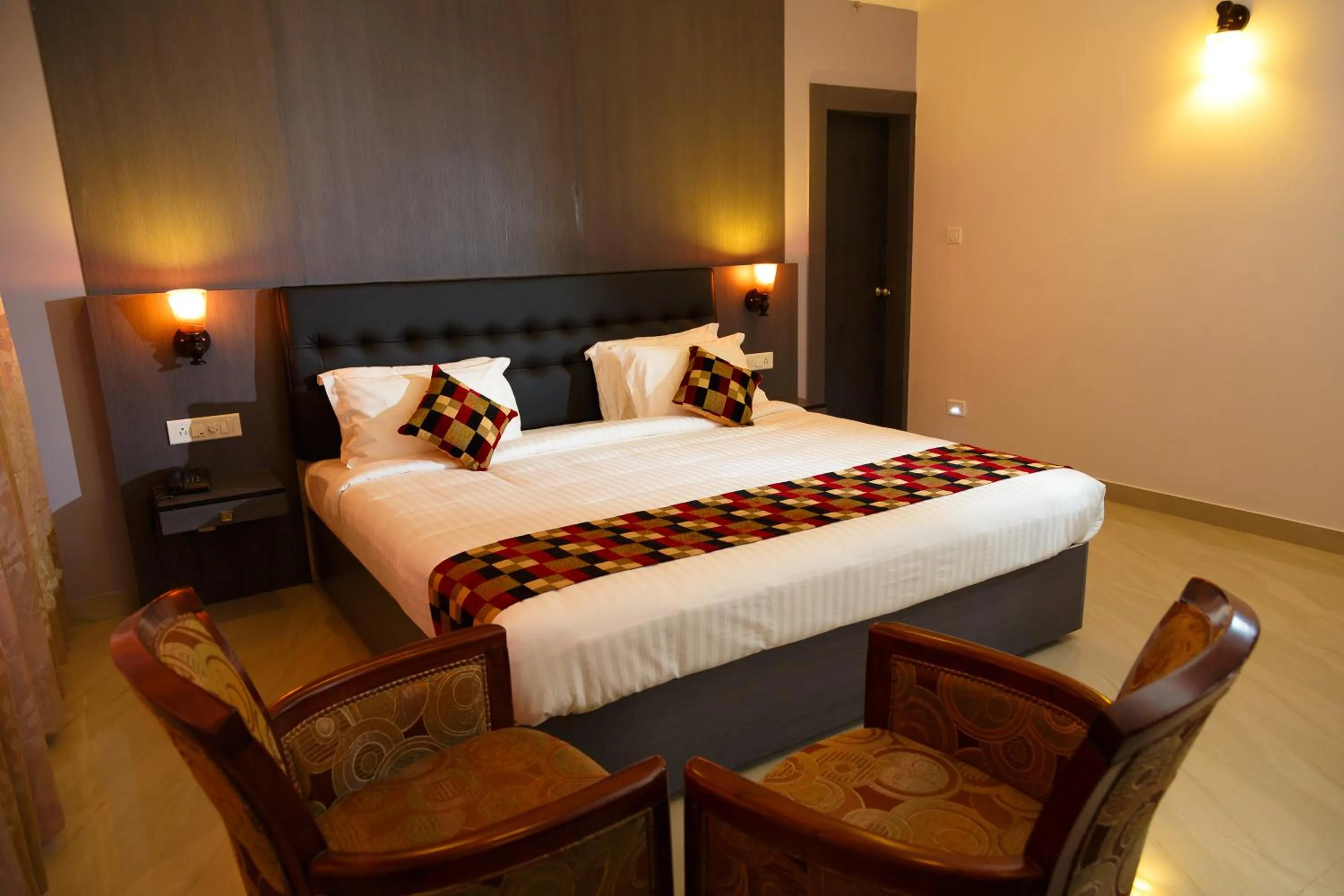 Bed in Hotel Gopalapuram International