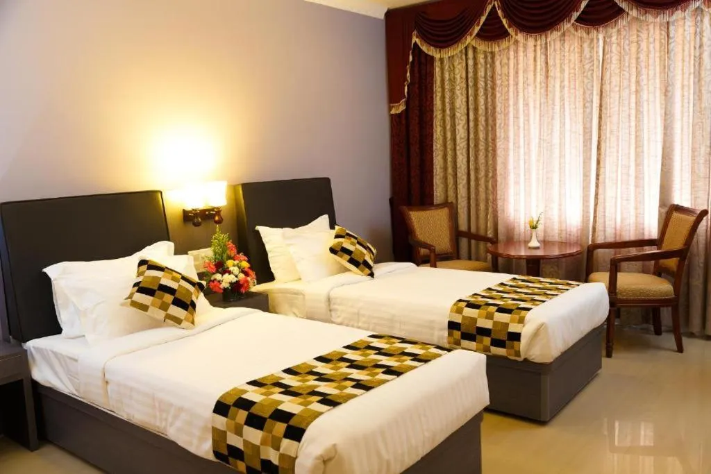 Bed in Hotel Gopalapuram International