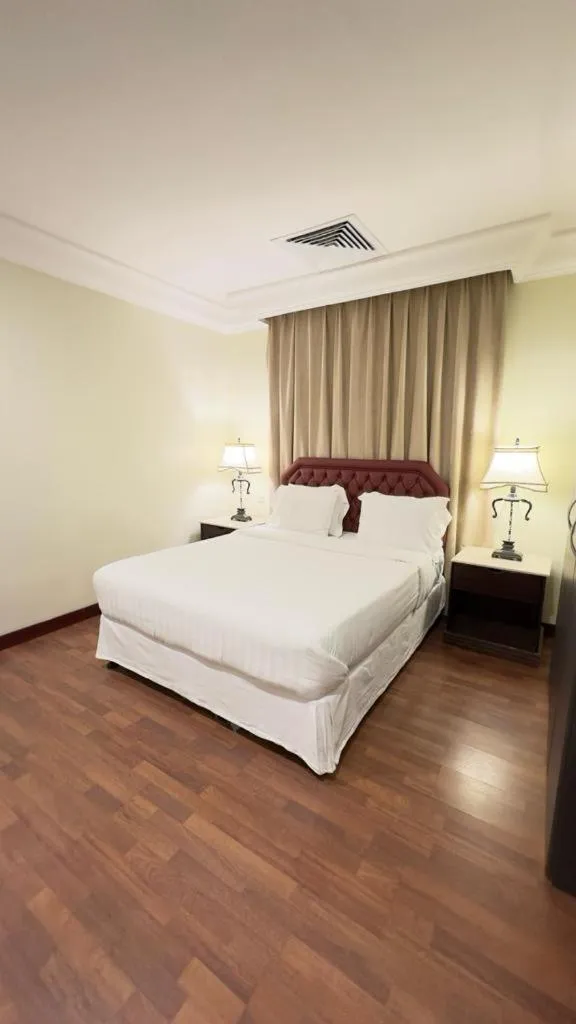 Bed in The Palace Suites