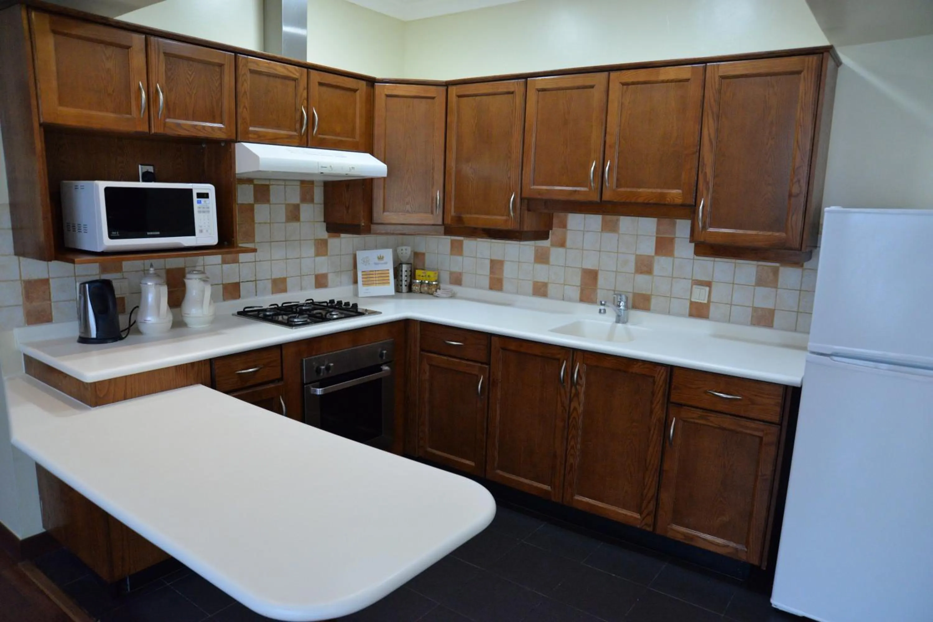 Kitchen or kitchenette in The Palace Suites