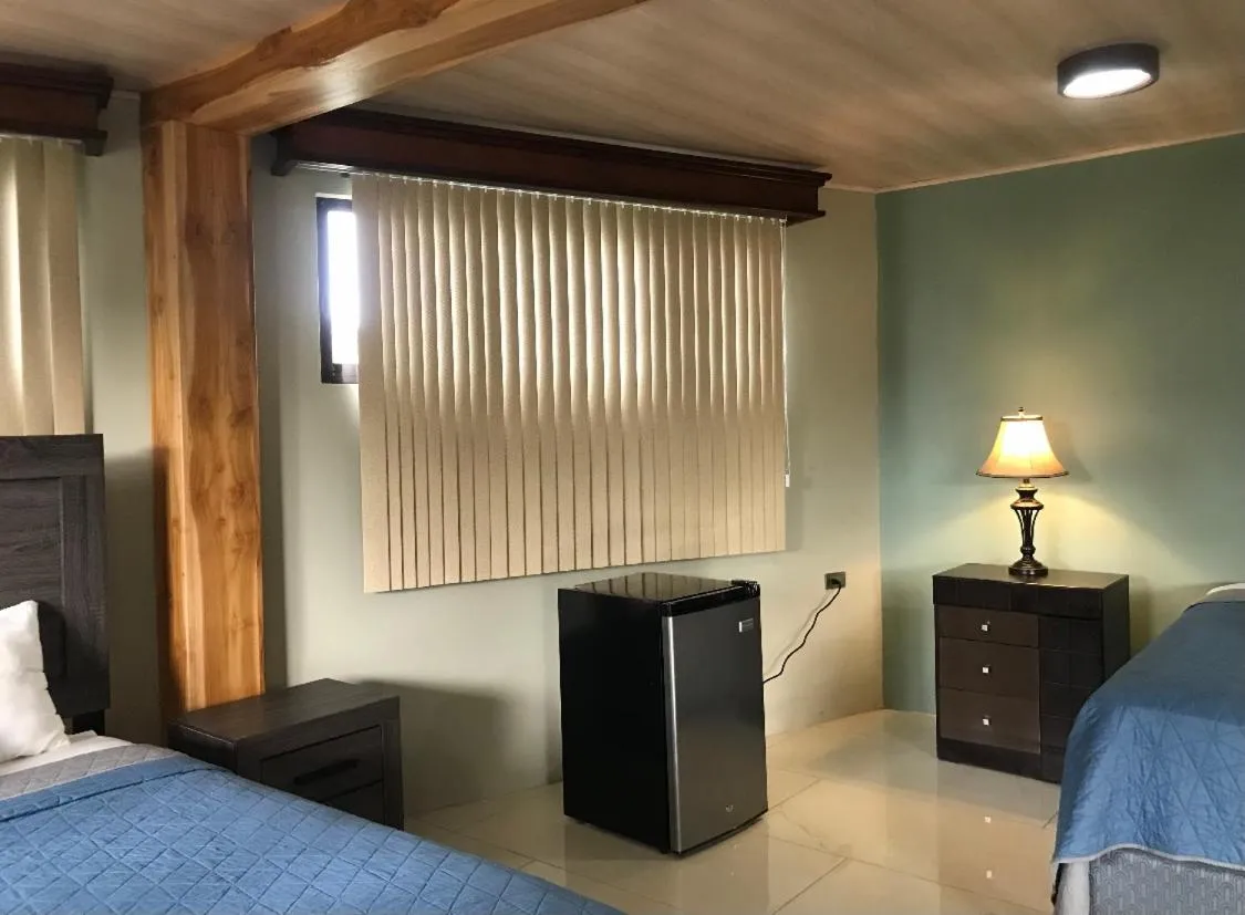 Photo of the whole room, Bed in Hotel Margarita and Tour Operator Drake Bay