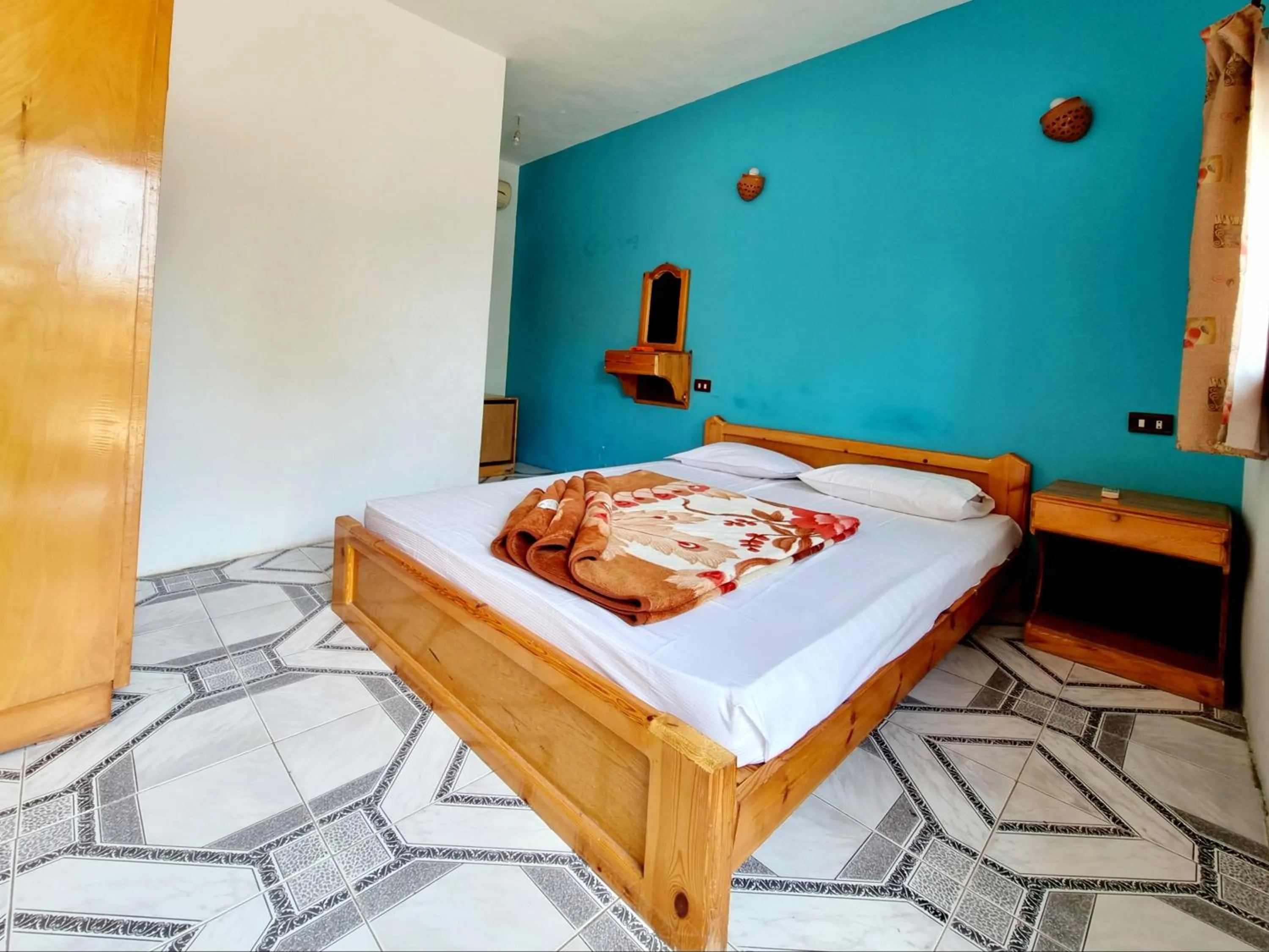 Bed in Jowhara Hotel