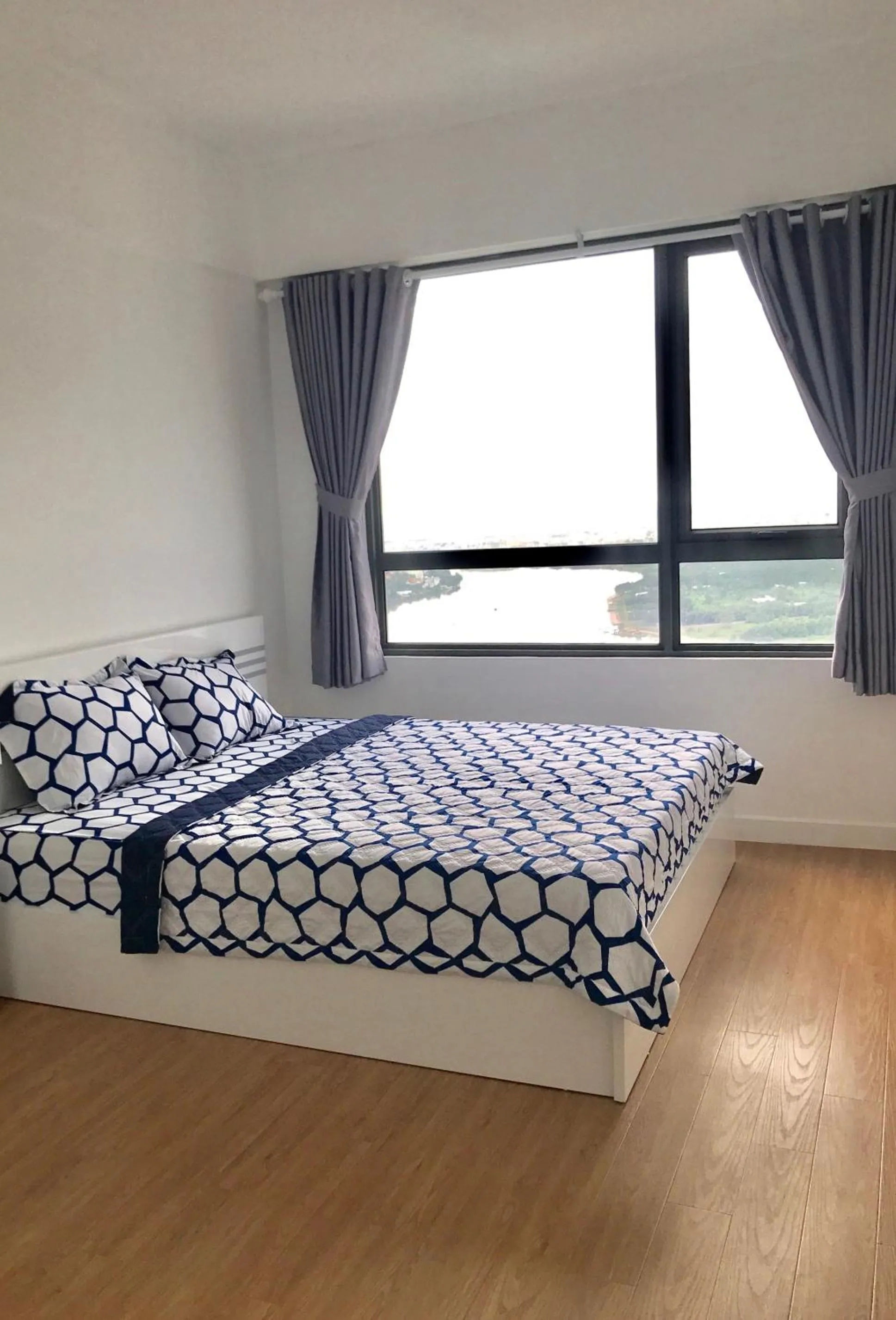 Bed in MRT Apartment In Masteri Thao Dien