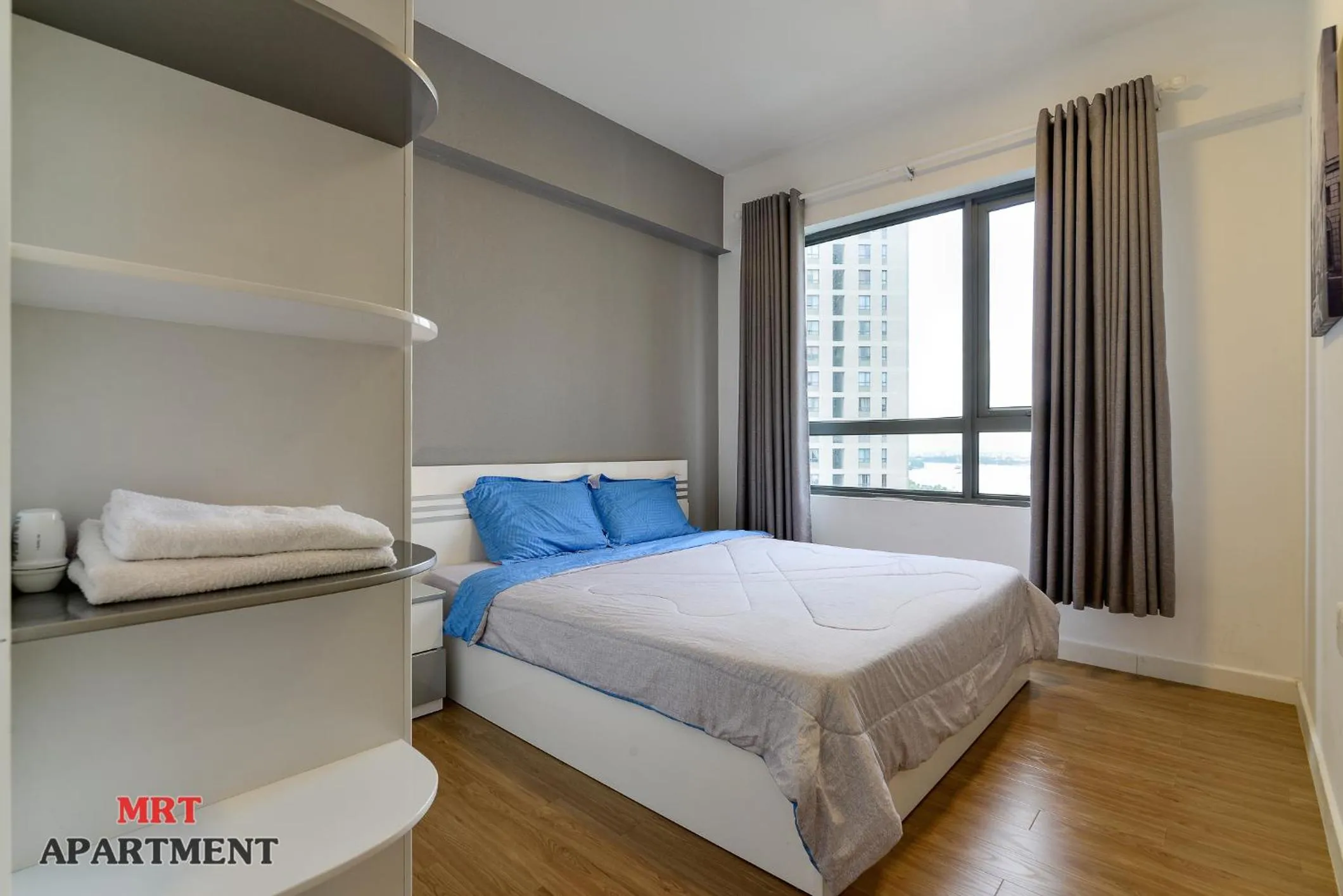 Bed in MRT Apartment In Masteri Thao Dien