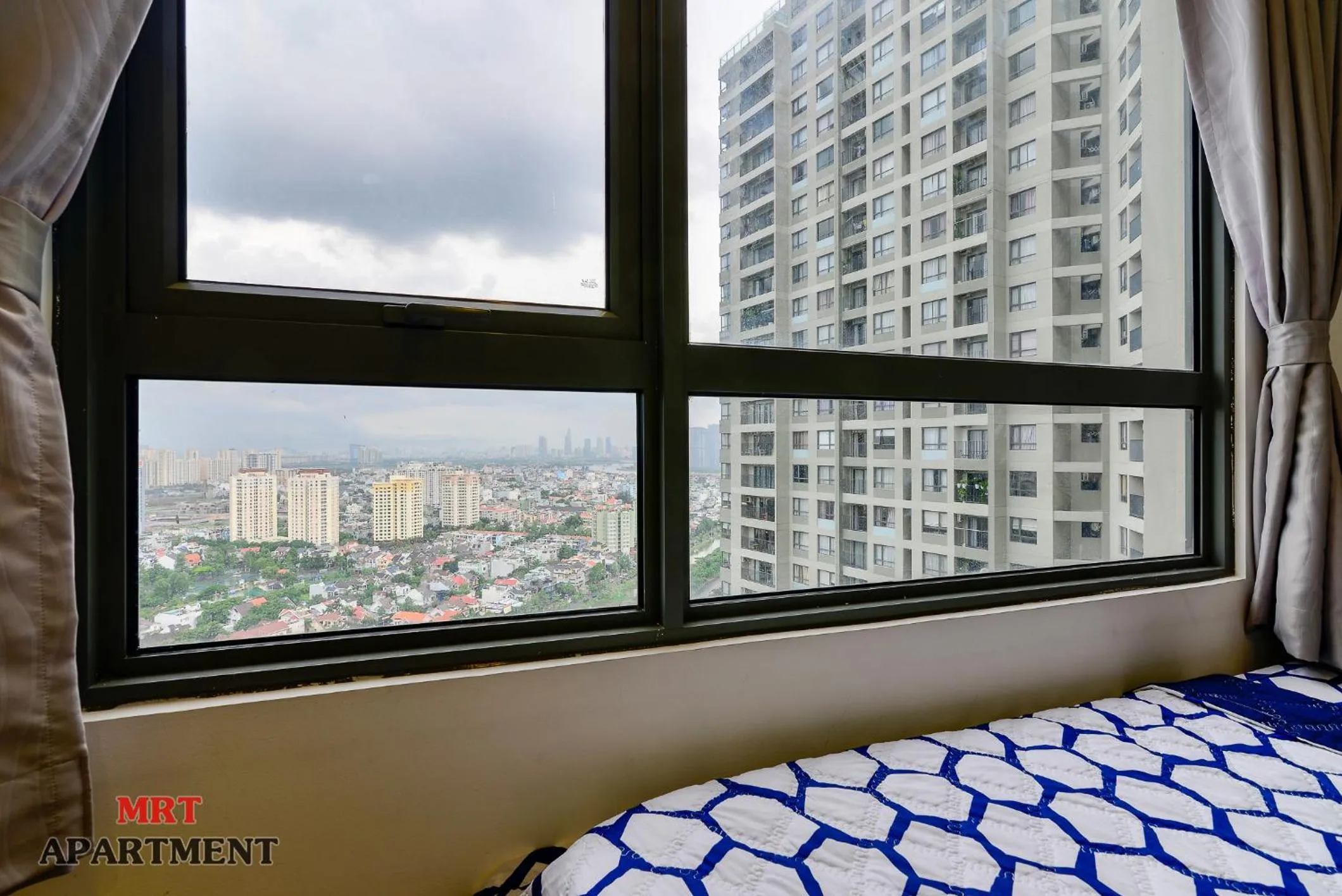 Bed in MRT Apartment In Masteri Thao Dien