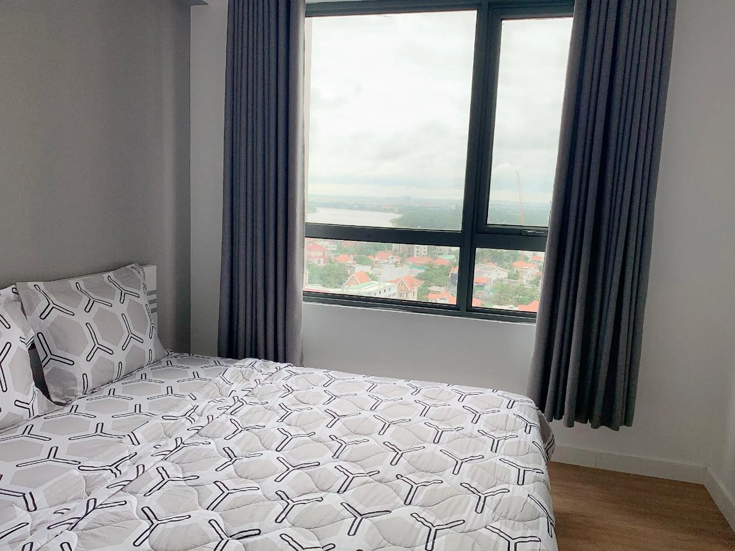 Bed in MRT Apartment In Masteri Thao Dien