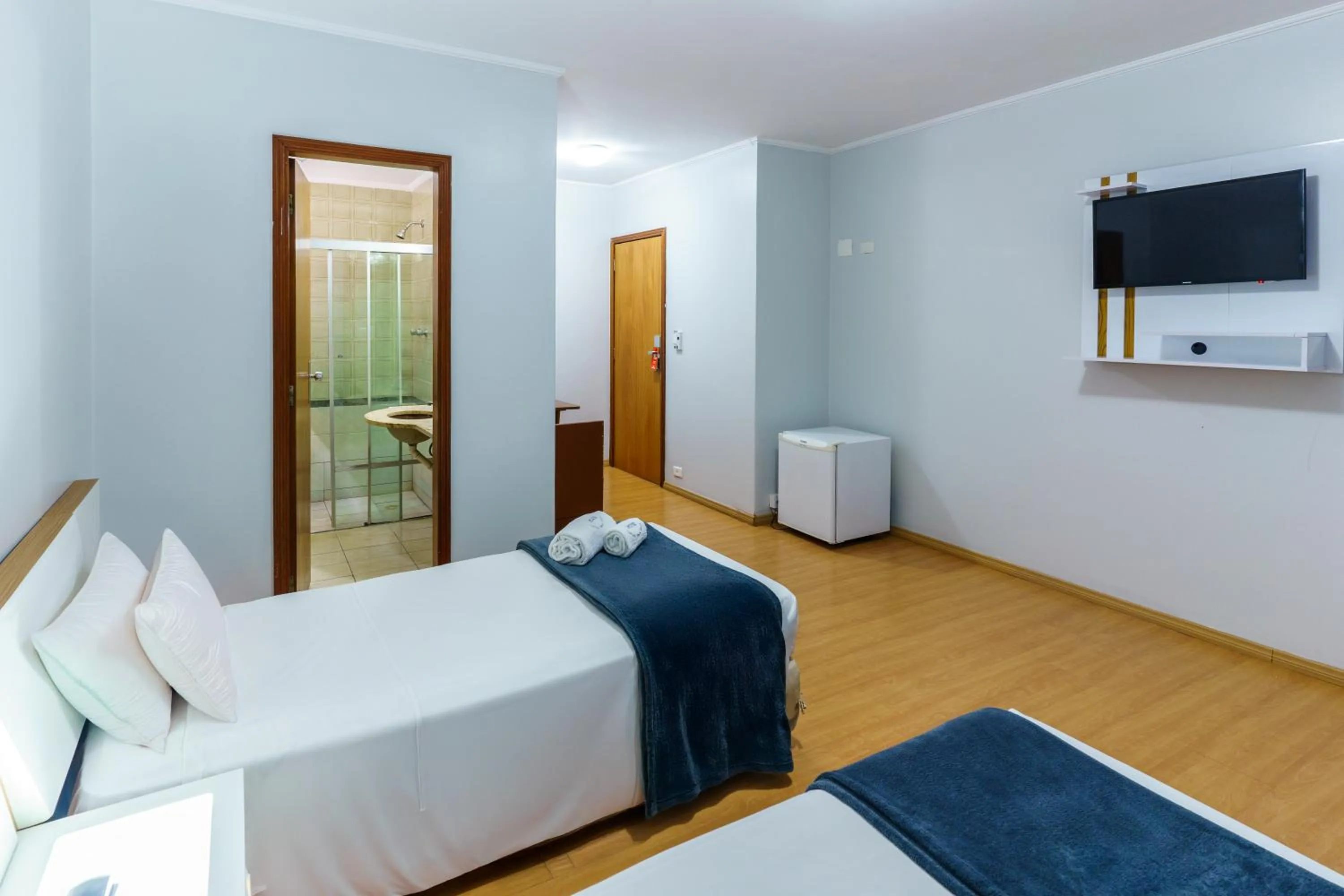 Bed in Carillon Plaza Hotel