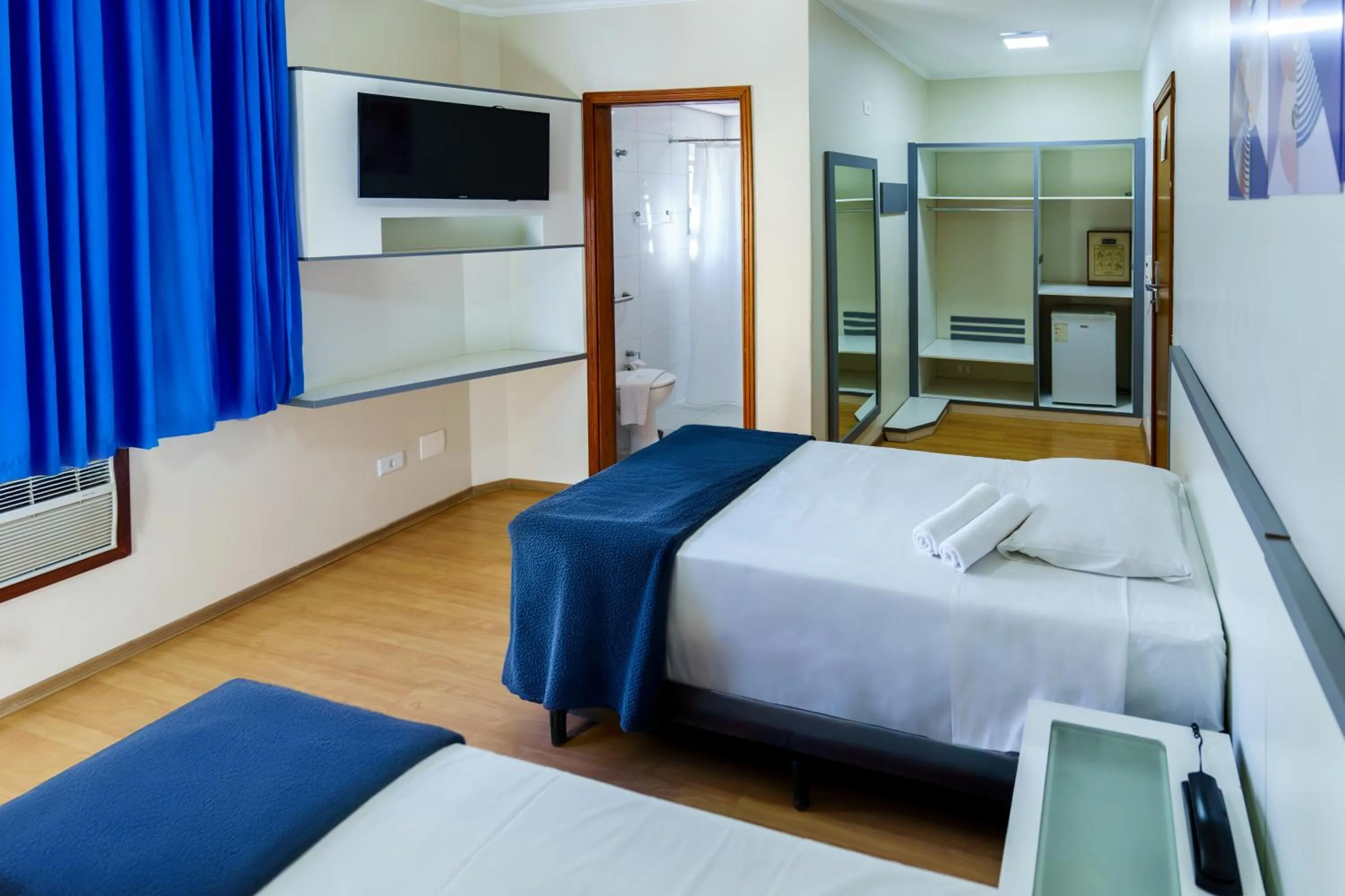 Bed in Carillon Plaza Hotel