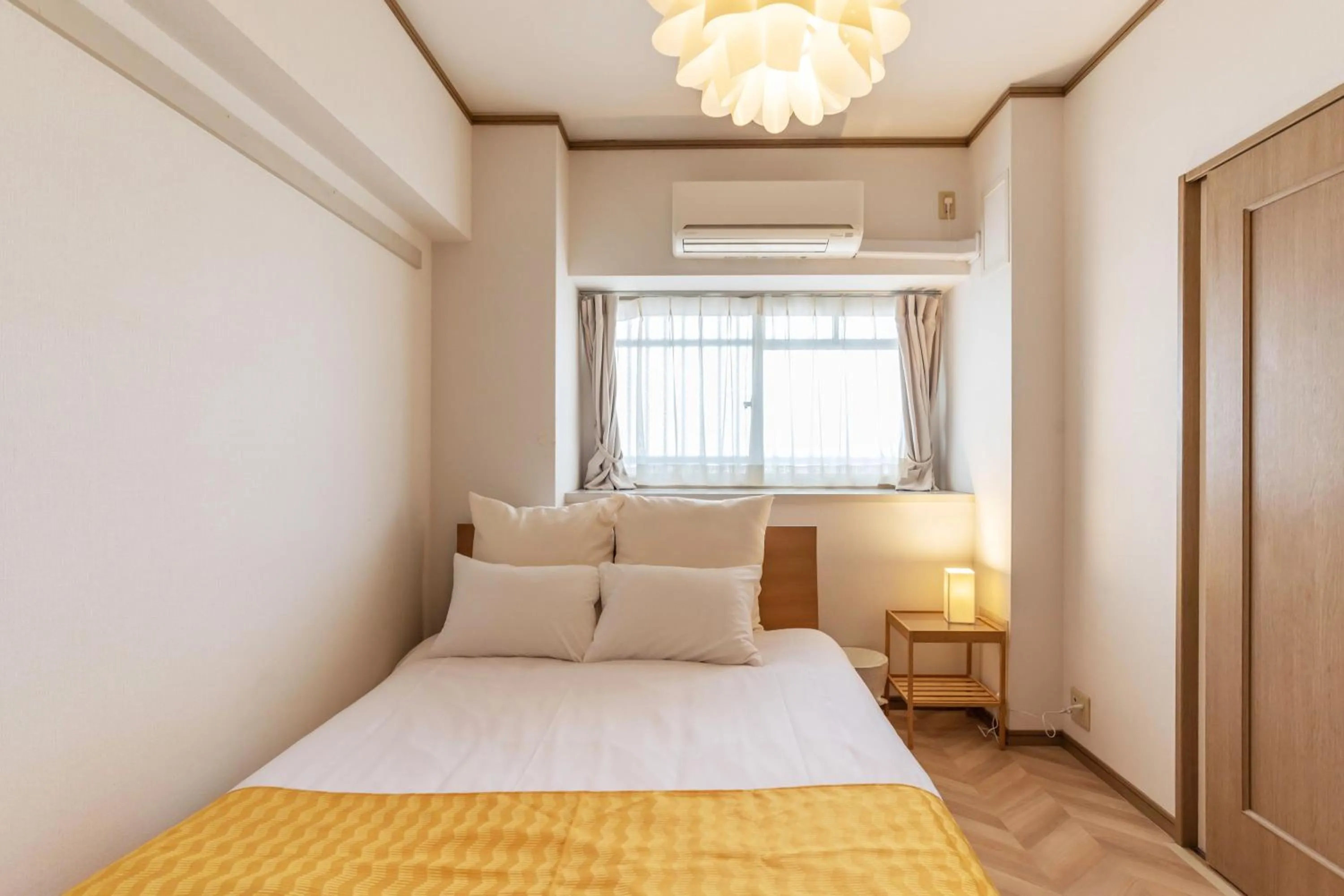 Bed in Universal Bay Condominium