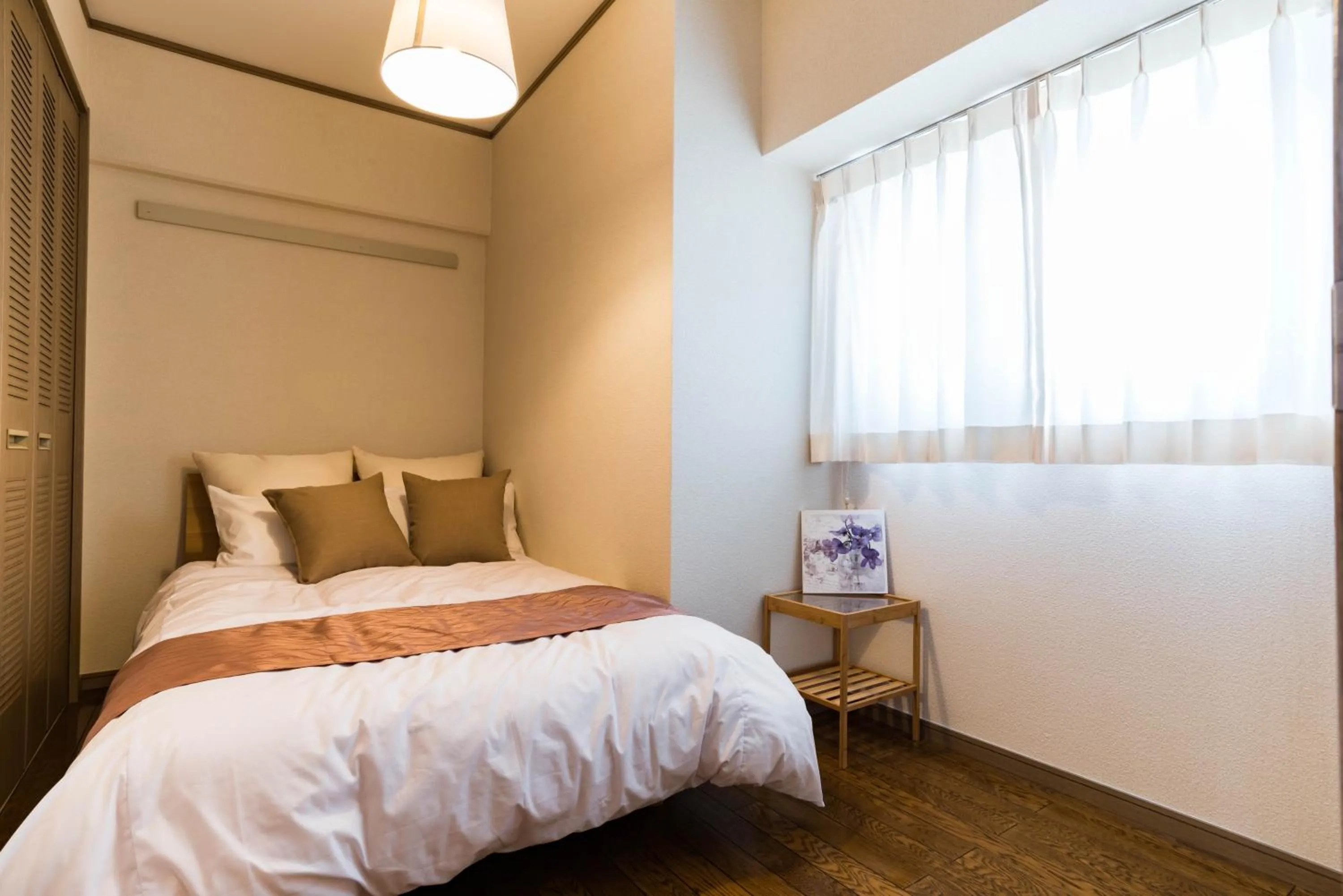 Bed in Universal Bay Condominium