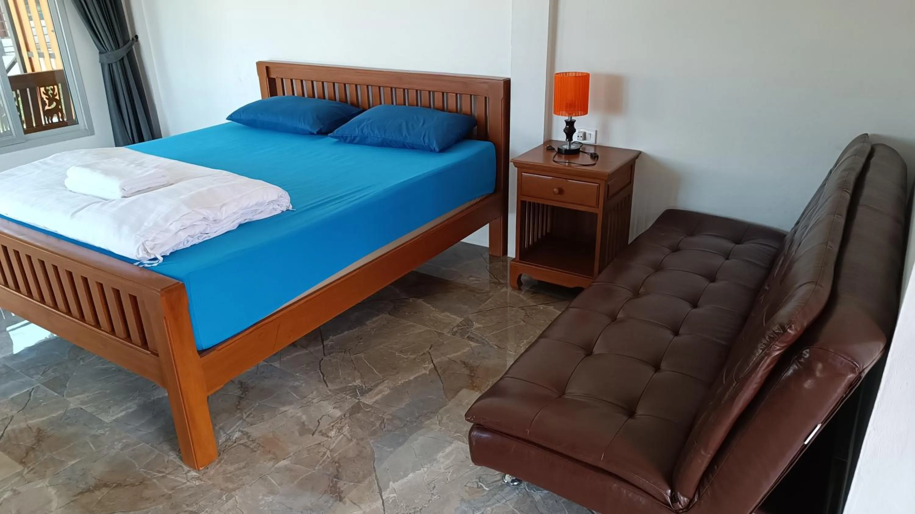 Bed in Green Mango Resort