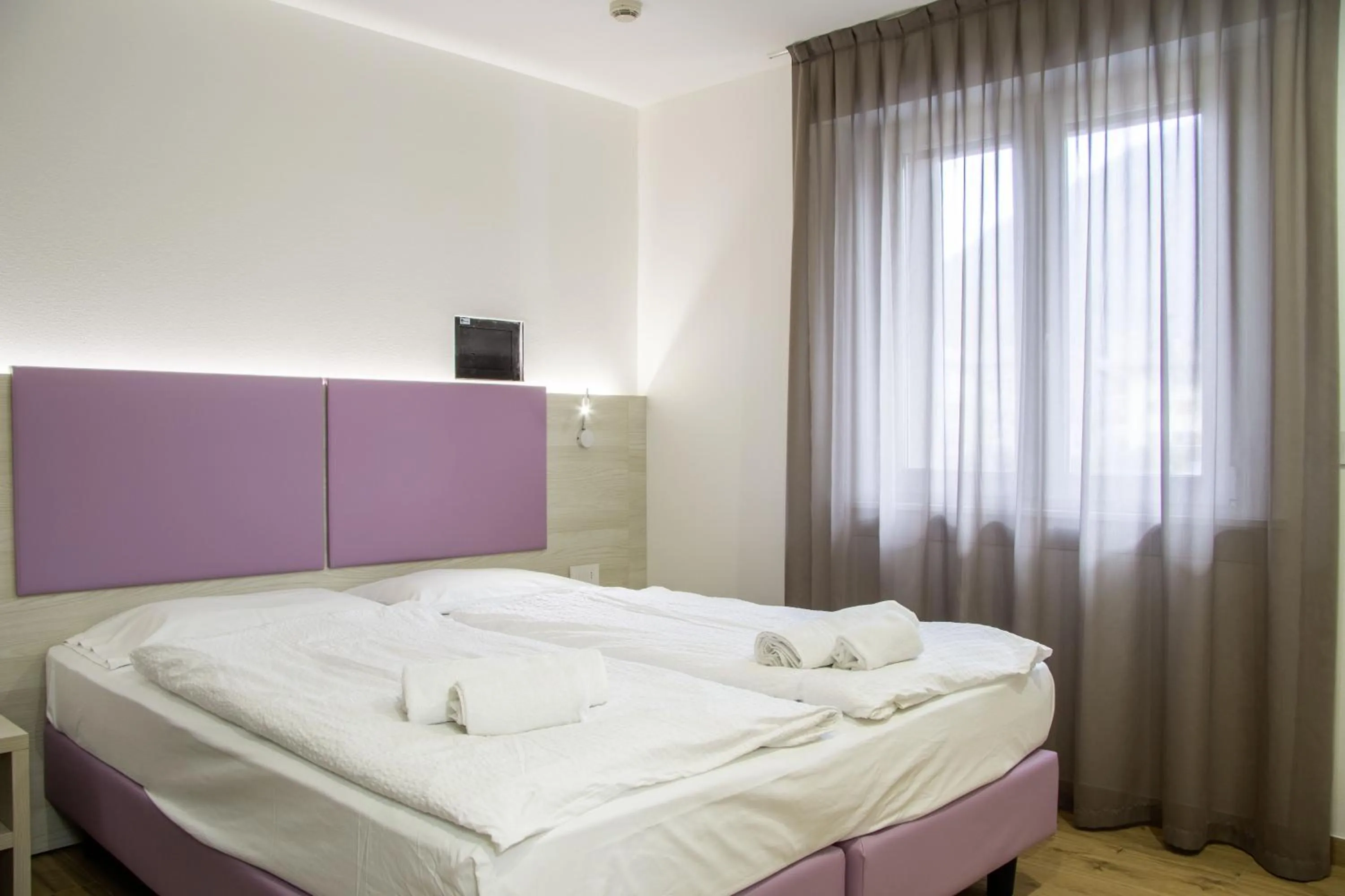 Bed in Liz Hotel & Apartments