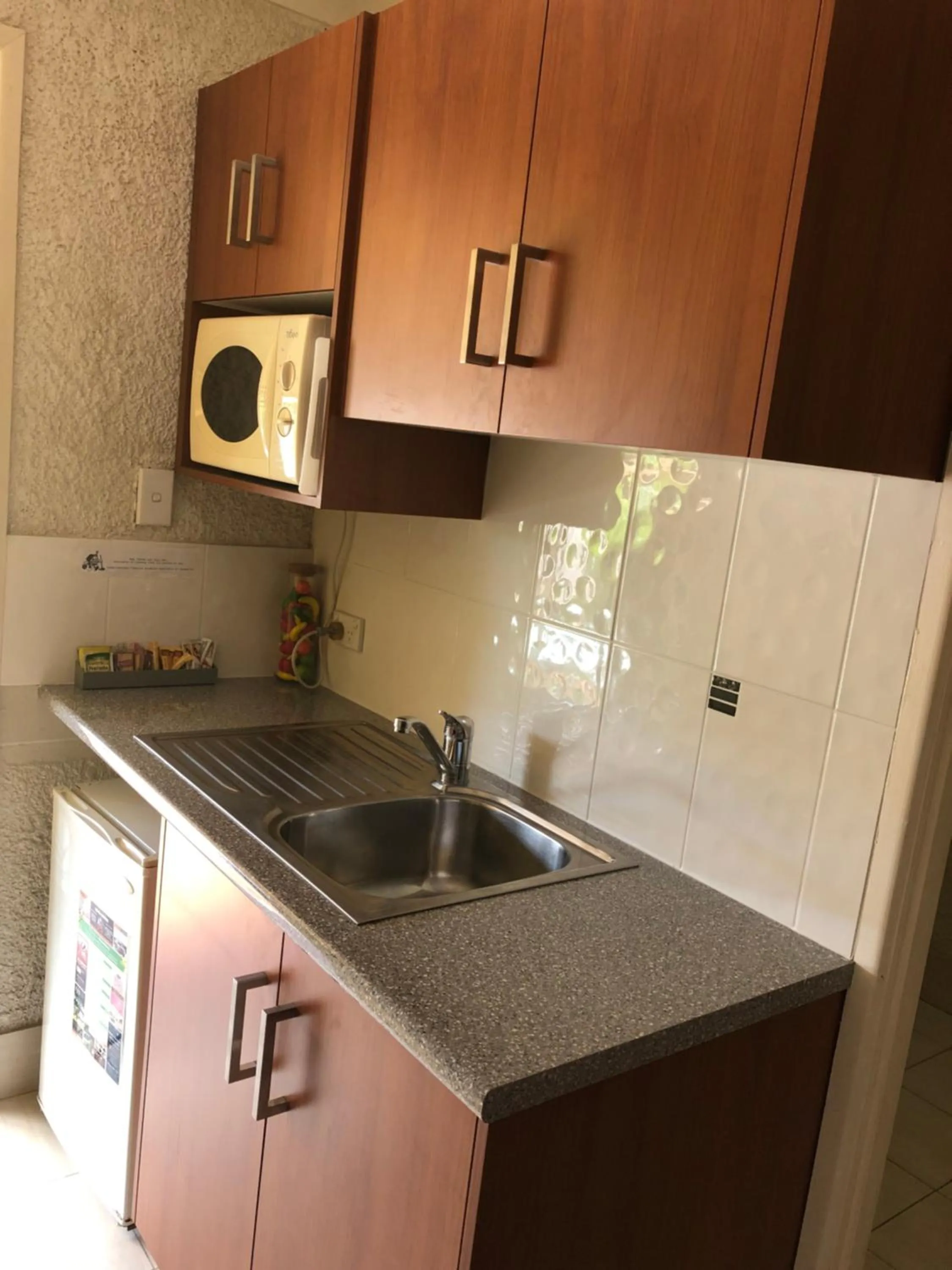 Kitchen or kitchenette in Bundaberg Coral Villa Motor Inn