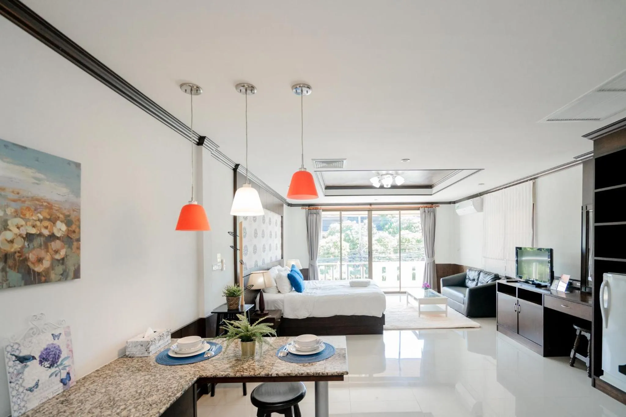 Communal lounge/ TV room in The Panwa Guesthouse, Phuket