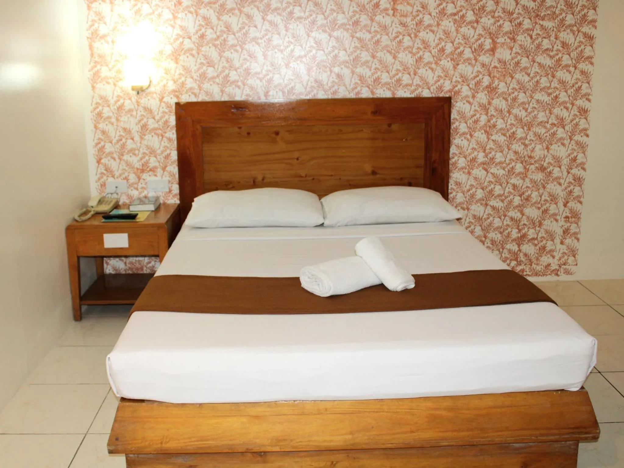 Bed in Rosas Garden Hotel