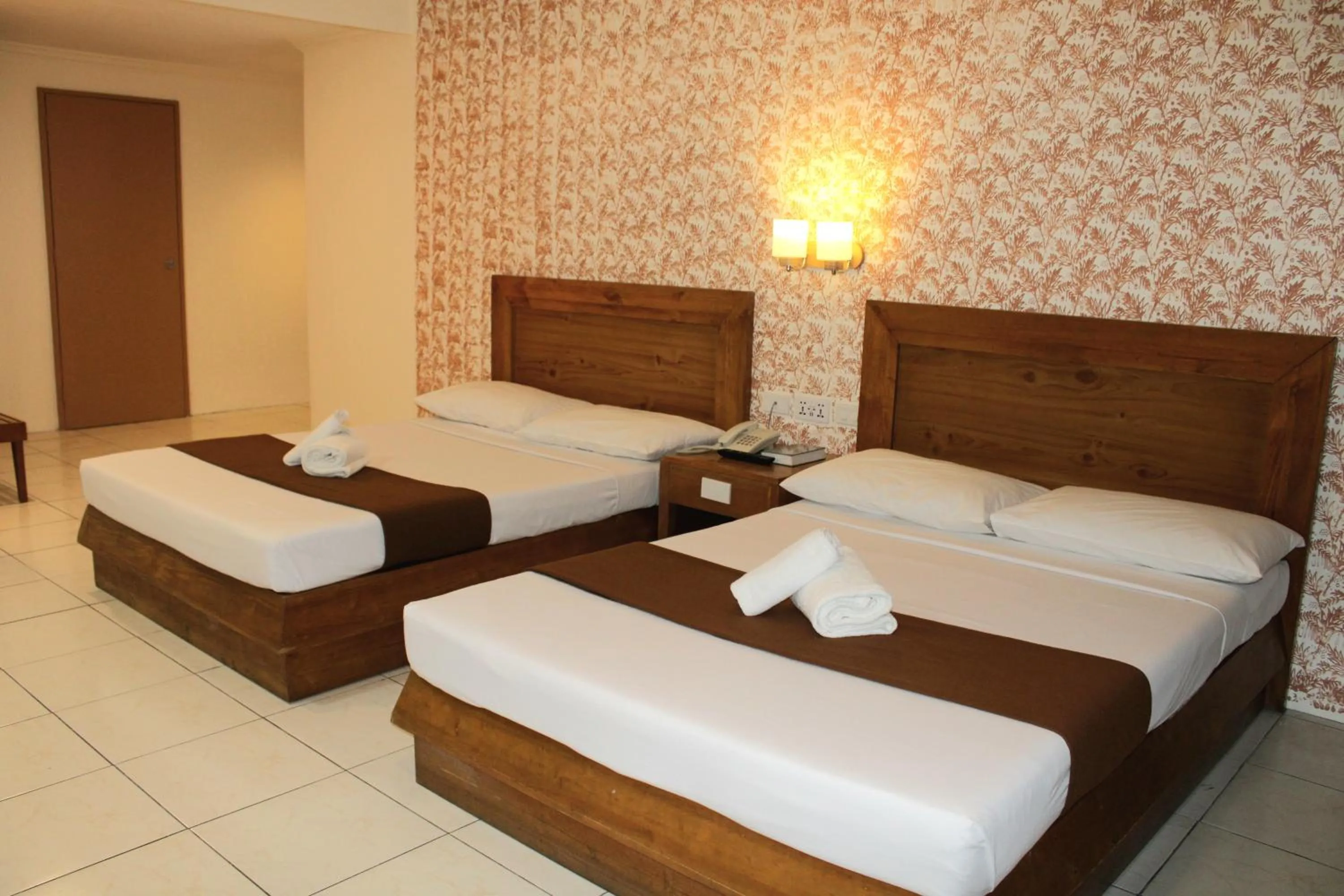 Bed in Rosas Garden Hotel