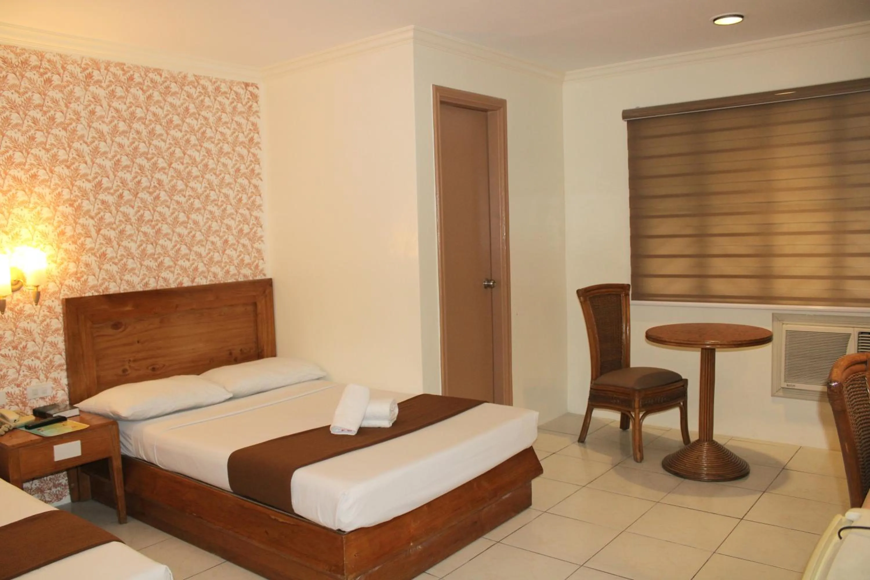 Bed in Rosas Garden Hotel