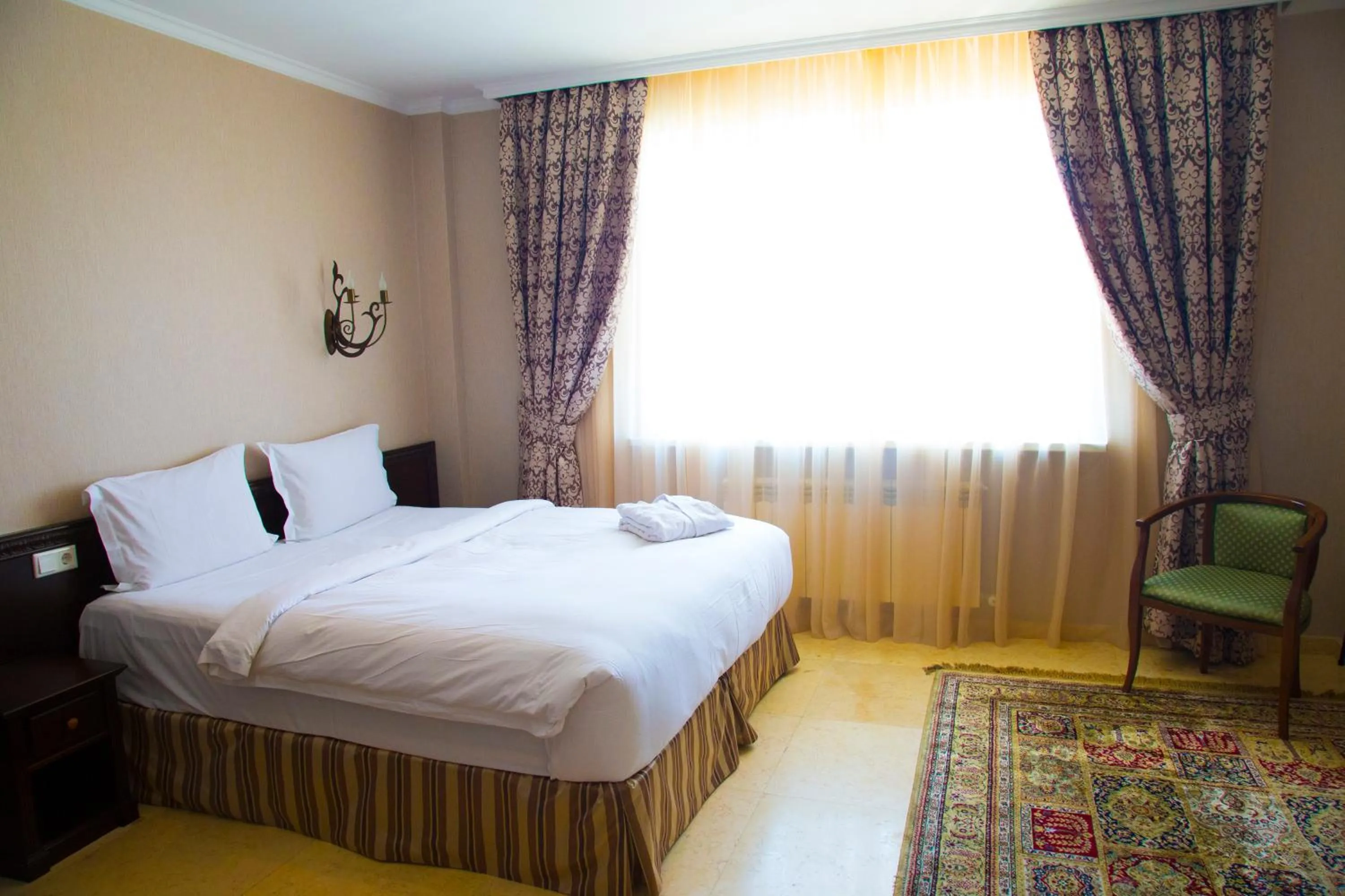 Bed in Royal Petrol Hotel