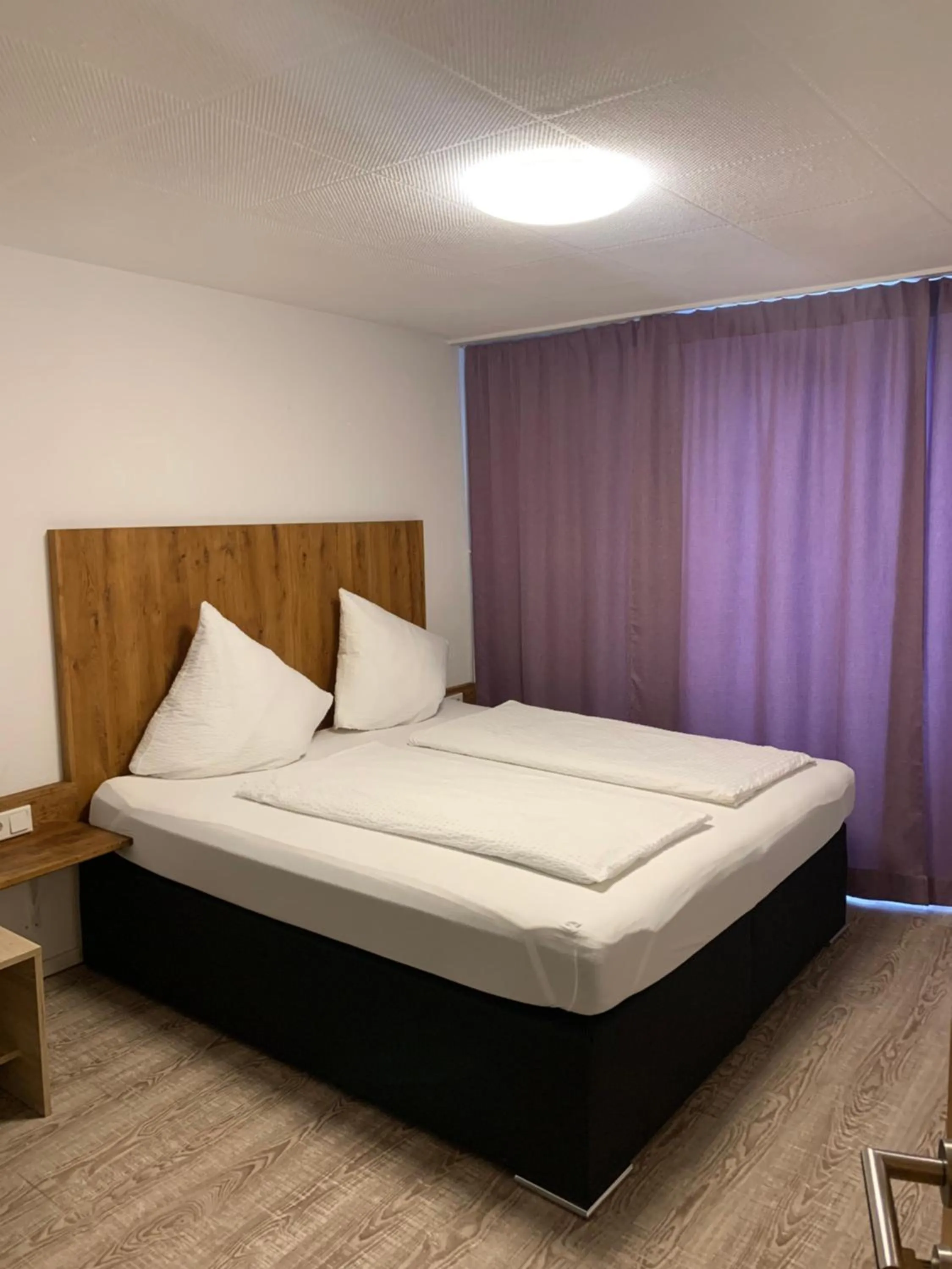 Bed in Smart Stay Rooms Feldkirch