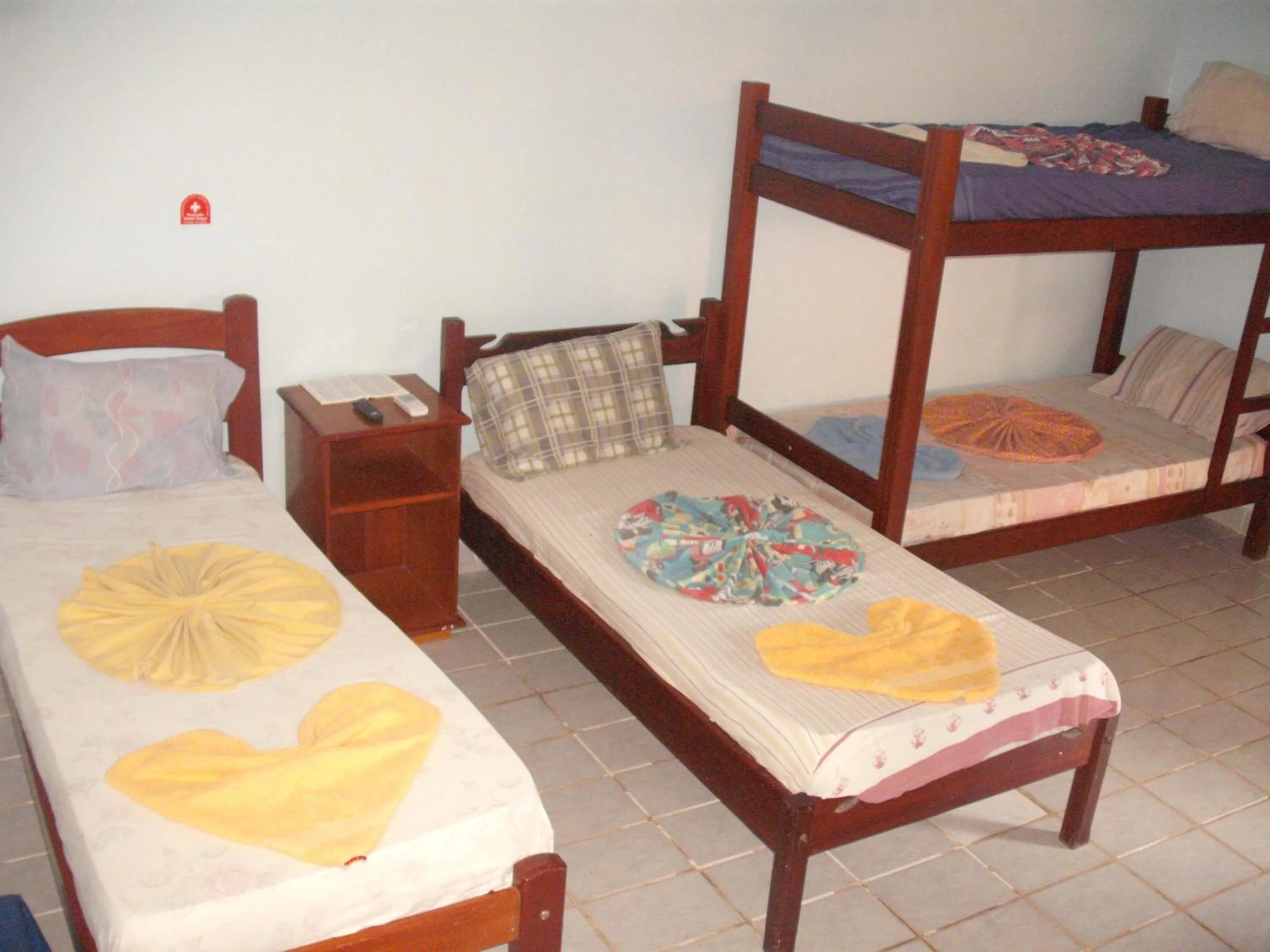 Photo of the whole room, Bed in Pousada Chalé Suiço
