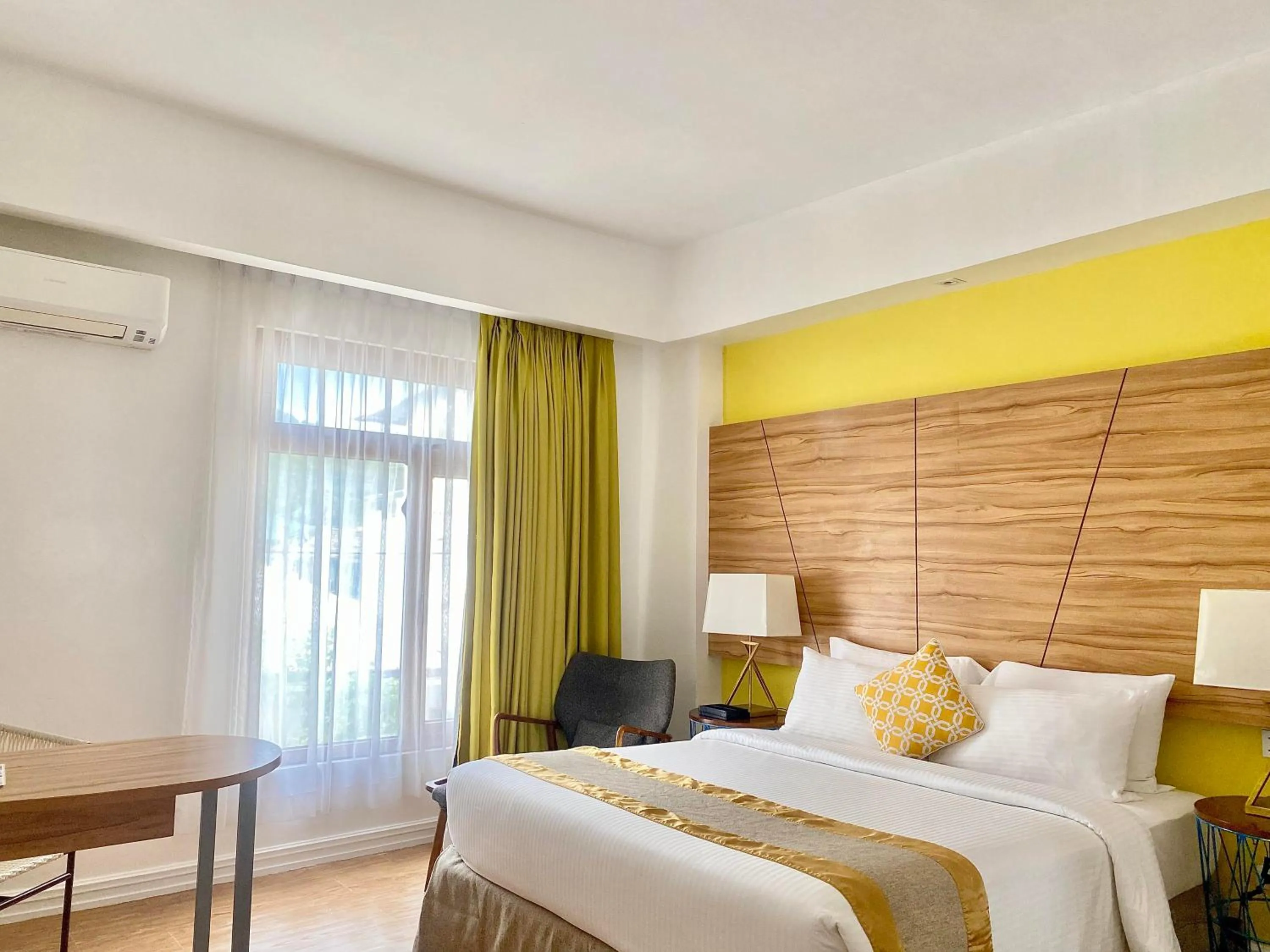 Bed in Ferra Hotel and Garden Suites