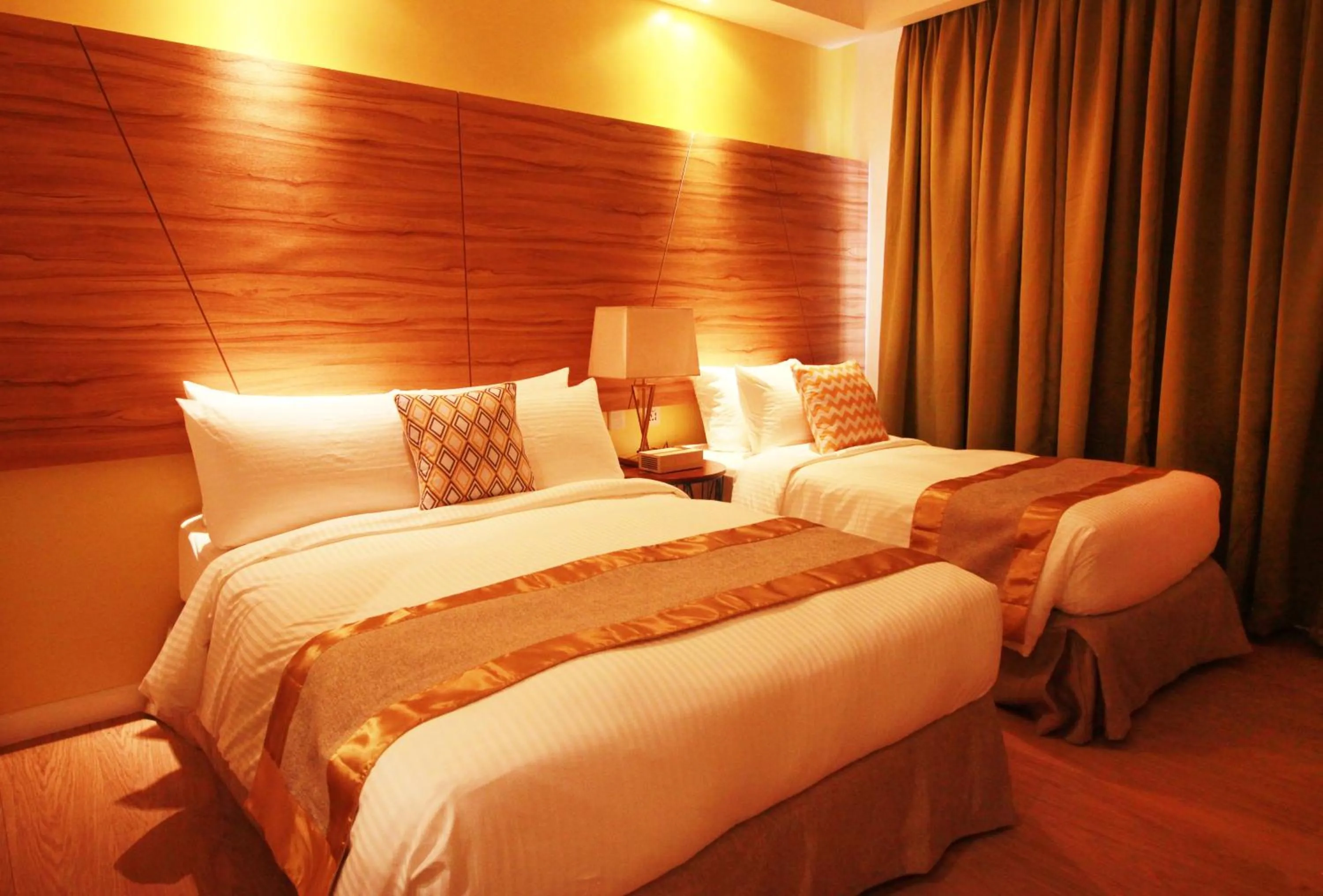 Bed in Ferra Hotel and Garden Suites