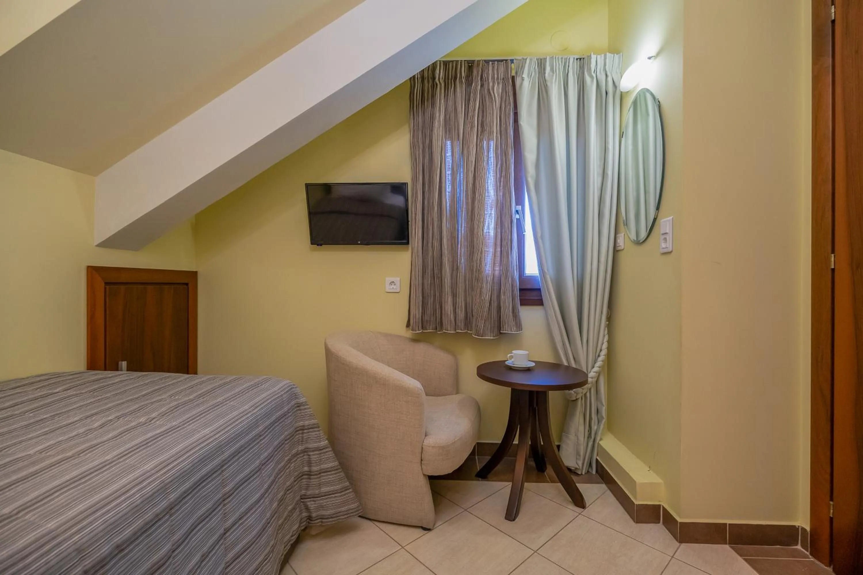 Bed in Meliton Inn Hotel & Suites by the beach